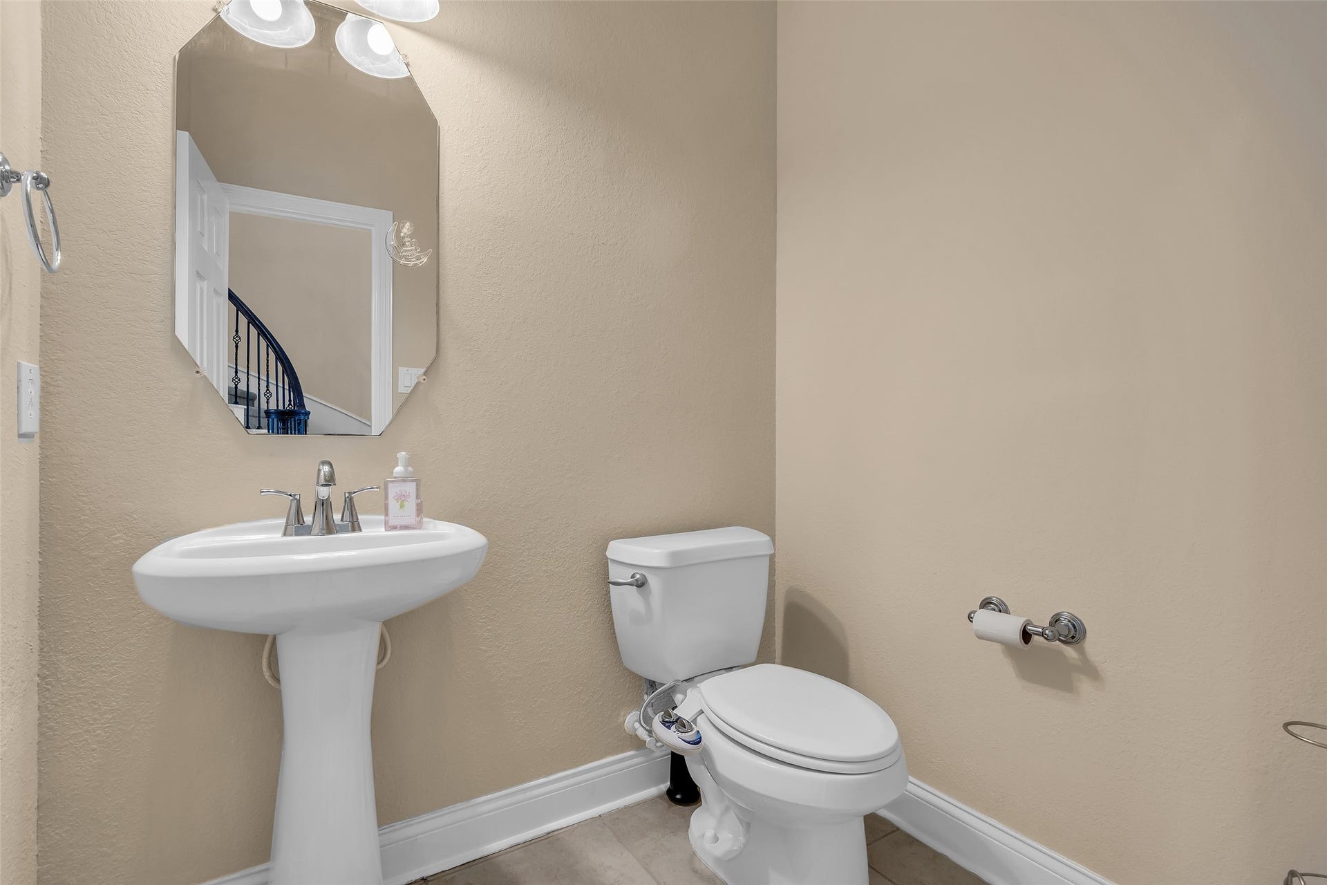 3314 Sussex Way, Friendswood, TX 77546 The first-floor half bath features modern fixtures and a functional layout designed for everyday convenience.