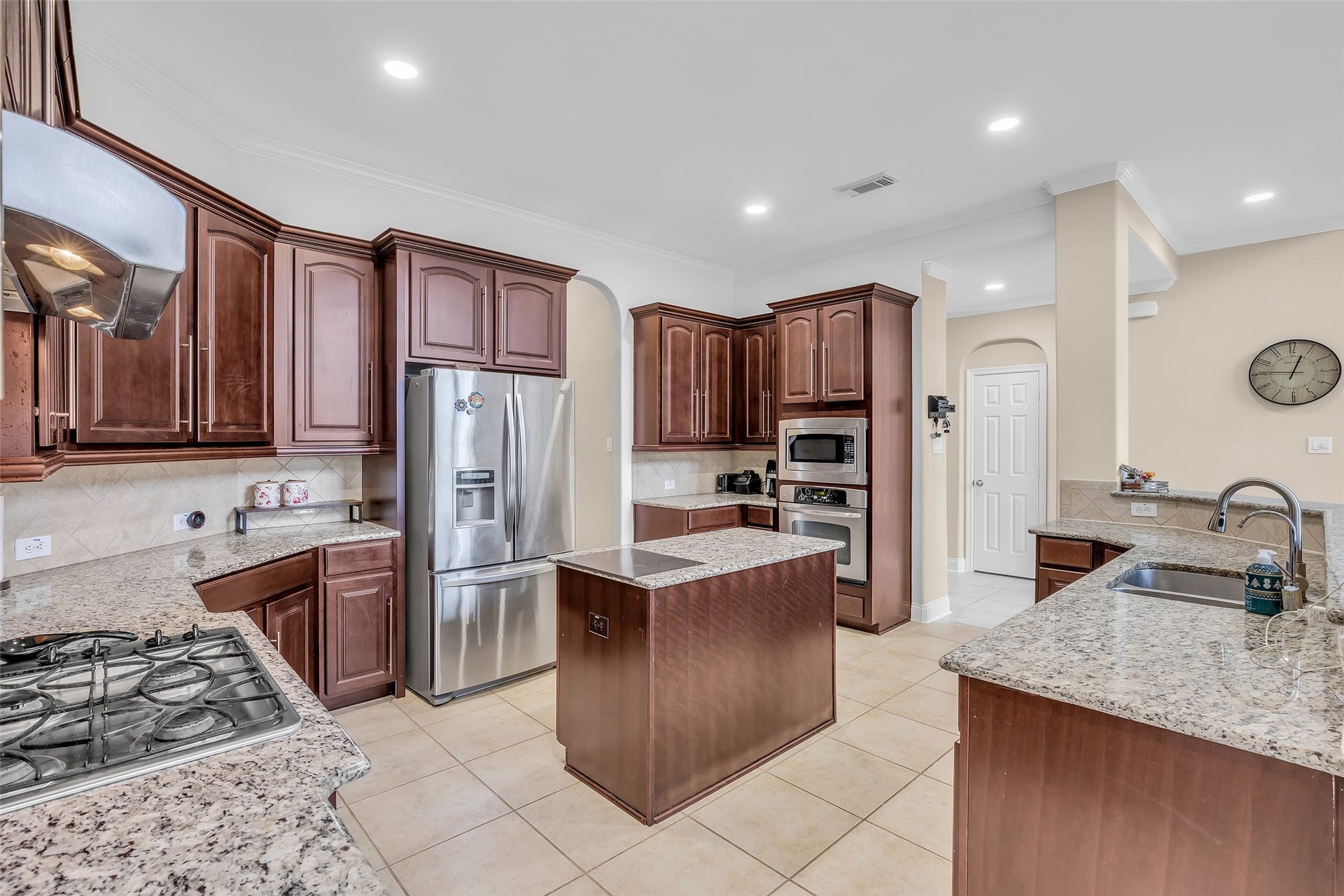 3314 Sussex Way, Friendswood, TX 77546 View of the kitchen highlighting its layout and included appliances, designed for both function and ease of use.