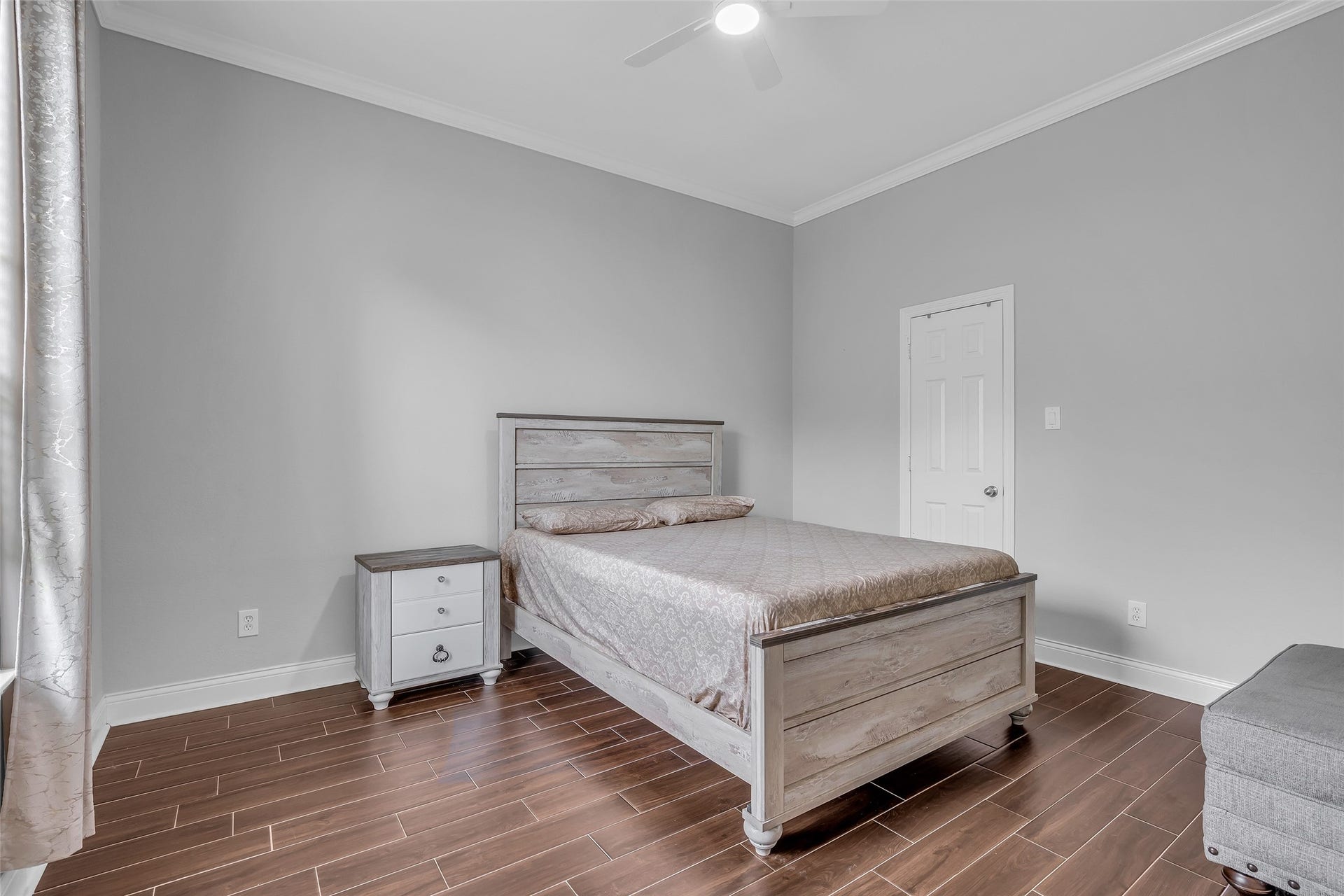 3314 Sussex Way, Friendswood, TX 77546 Secondary bedroom on the first floor featuring tiled flooring and a window overlooking the backyard.