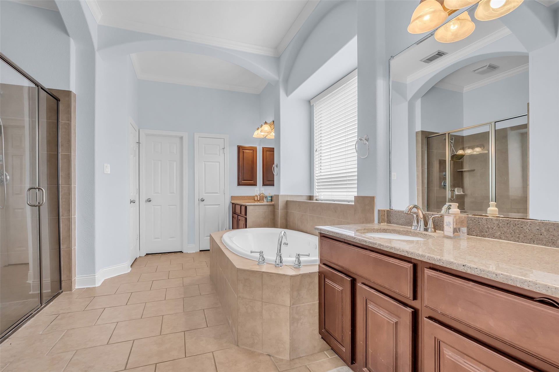 3314 Sussex Way, Friendswood, TX 77546 Spacious primary bathroom featuring a separate tub and shower, along with double sinks for added convenience.