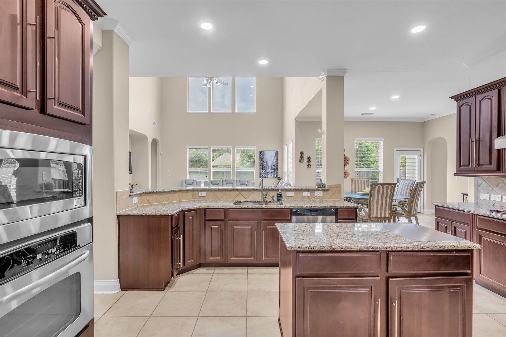 3314 Sussex Way, Friendswood, TX 77546 It includes a kitchen island that provides extra workspace for meal preparation and can also be used for casual dining.