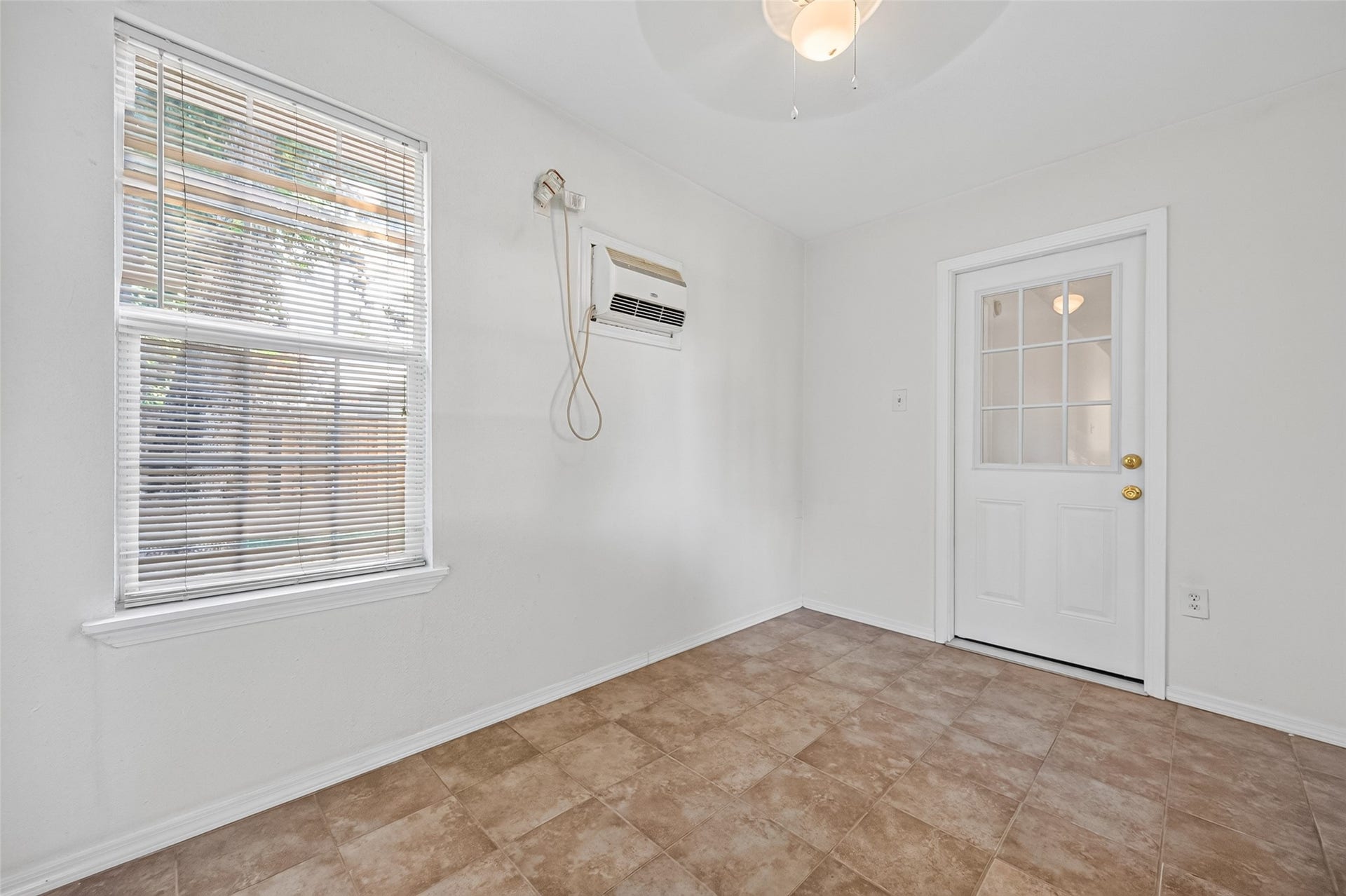 2703 Blue Mist Drive, Sugar Land, TX 77498 Bright bathroom featuring a spacious vanity, elegant tile flooring, and a window offering natural light.