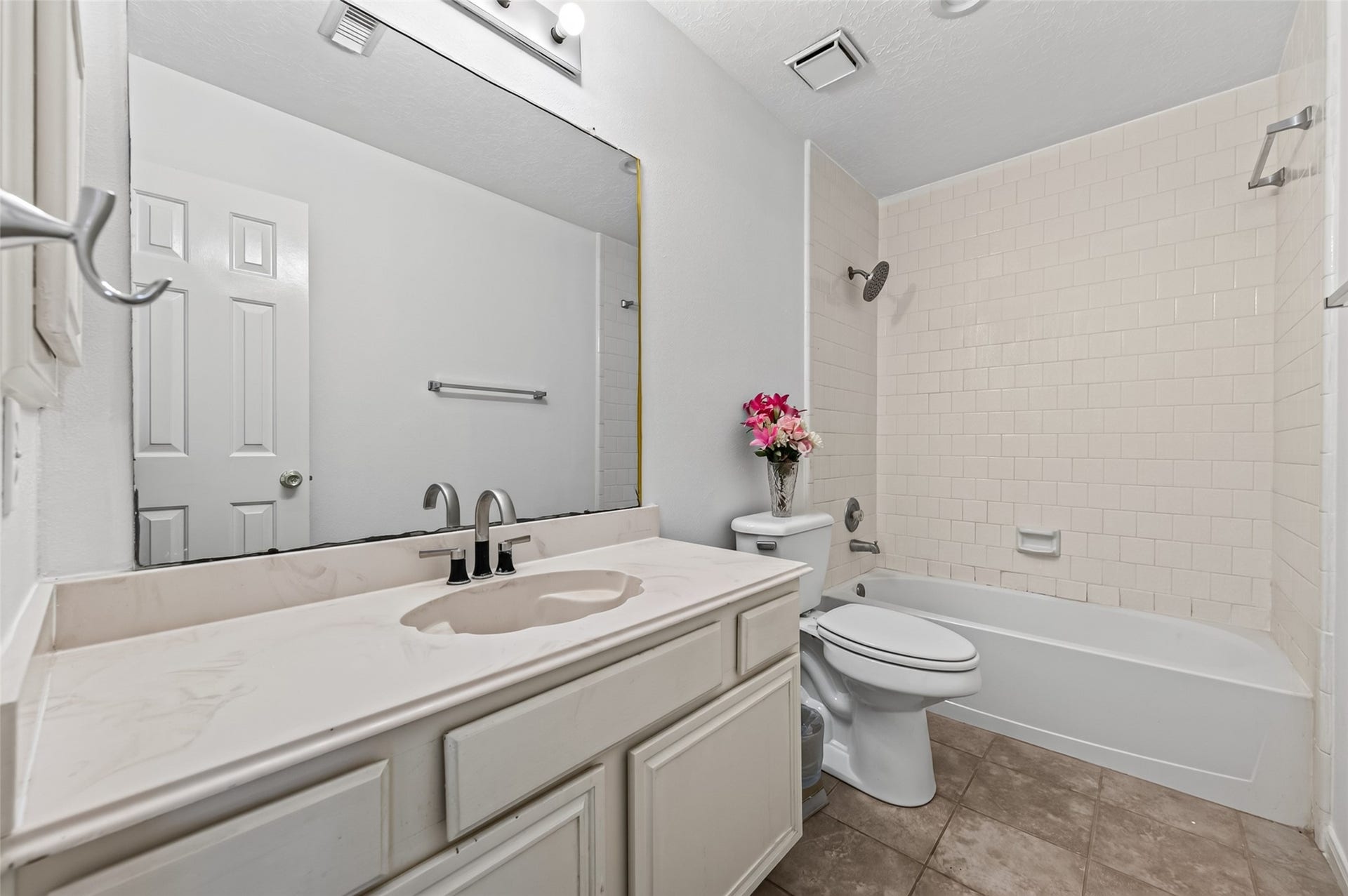2703 Blue Mist Drive, Sugar Land, TX 77498 Bright and airy bedroom featuring a ceiling fan, plush carpeting, and double closet doors for ample storage.