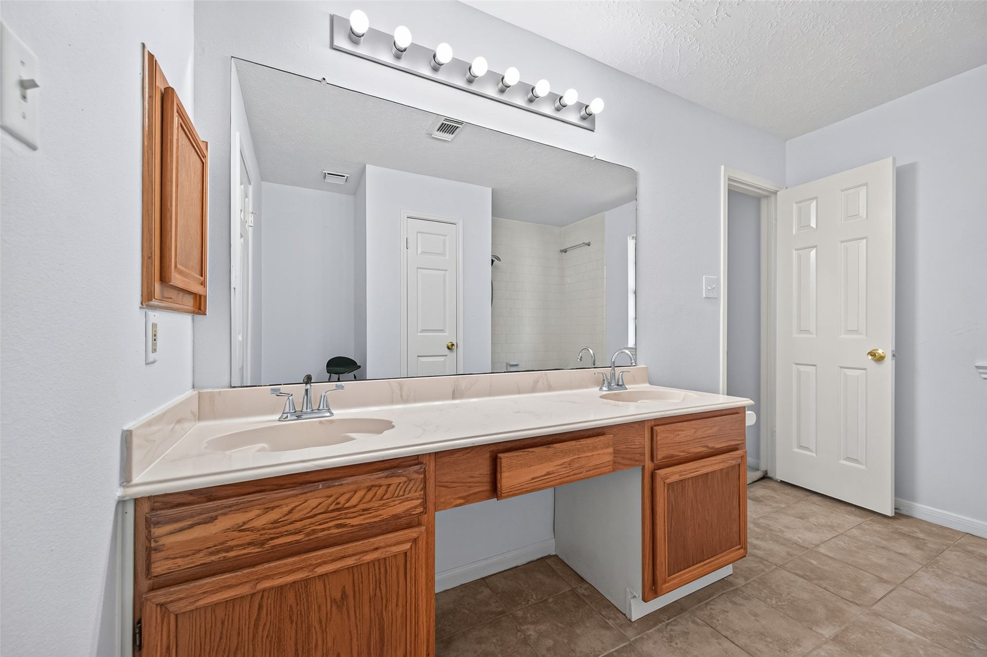 2703 Blue Mist Drive, Sugar Land, TX 77498 Spacious and bright bedroom featuring neutral carpeting, a ceiling fan, and a large window offering ample natural light.