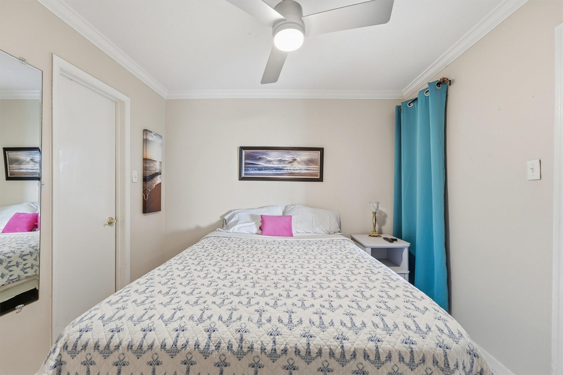 6300 Seawall Boulevard, #9321, Galveston, TX 77551 Bedroom with ceiling fan and soft coastal tones