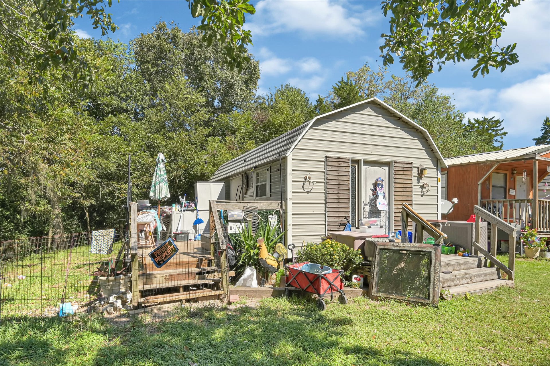 121 Patterson Road, Brazoria, TX 77422 This cottage features a porch perfect for relaxation, decoration, and entertaining guests.