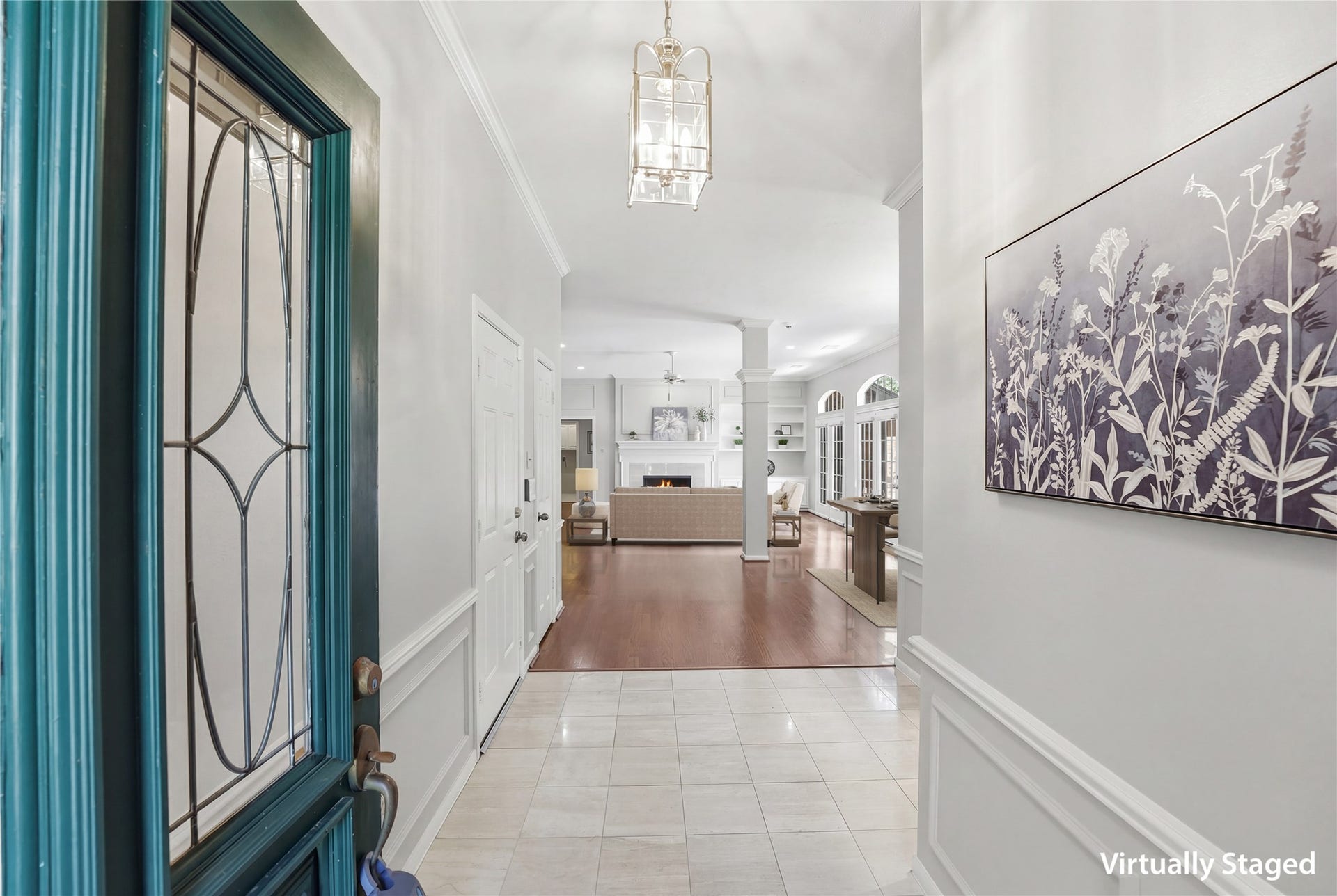 3203 Hickory Brook Lane, Houston, TX 77345 Bright entry with decorative glass front door and a view into the main living spaces. Virtually staged.