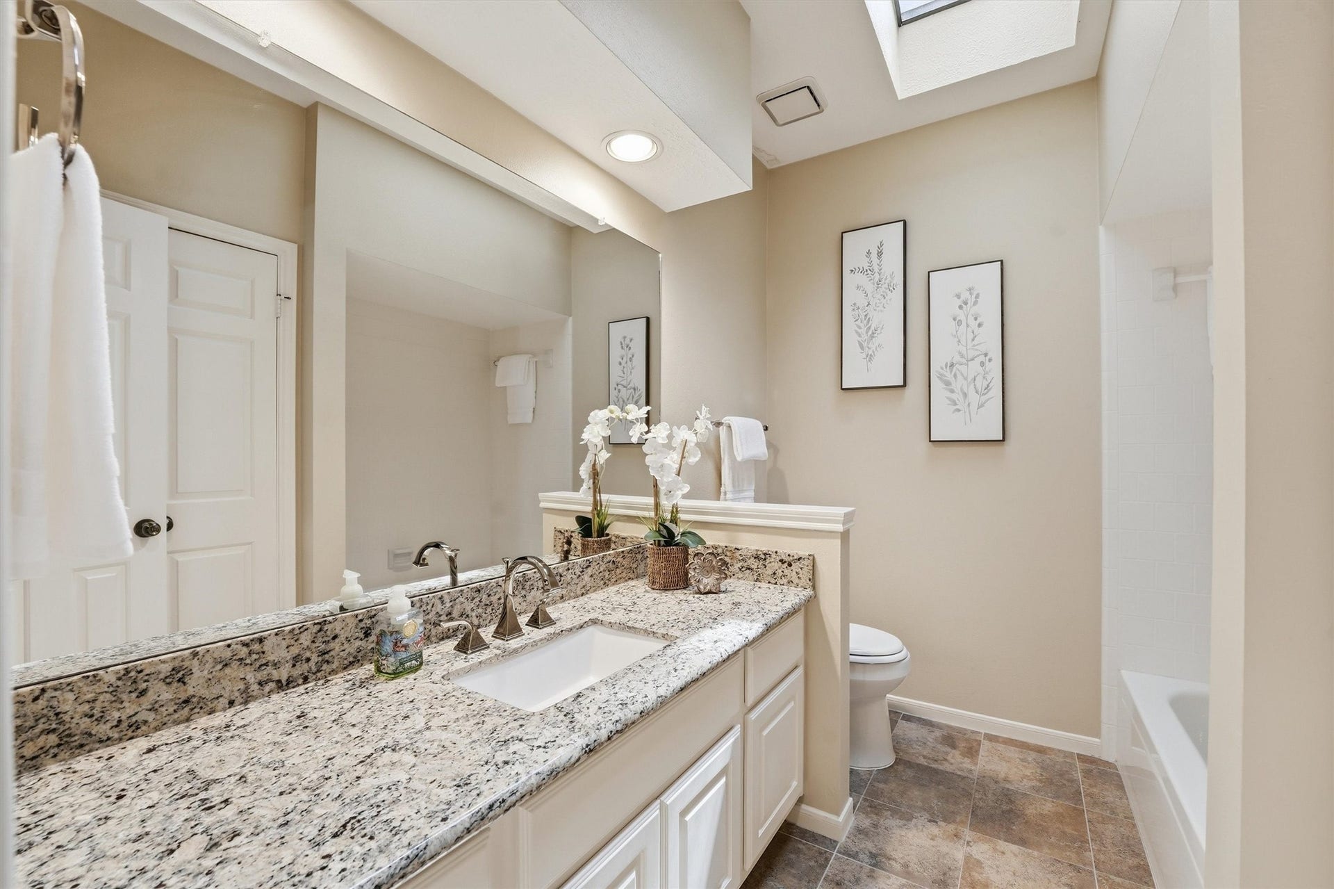 3203 Hickory Brook Lane, Houston, TX 77345 Secondary bathroom with granite vanity countertop and tub/shower combination.