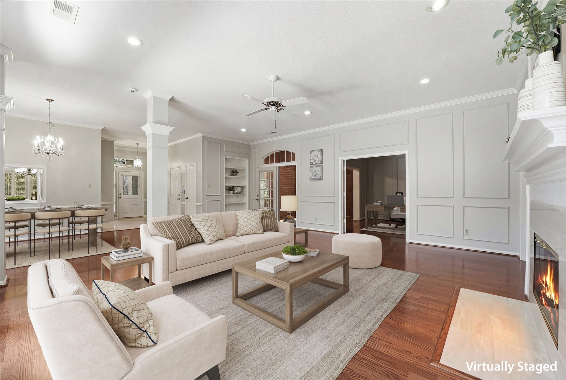 3203 Hickory Brook Lane, Houston, TX 77345 Family room view showing its connection to the dining area and kitchen. Virtually staged.