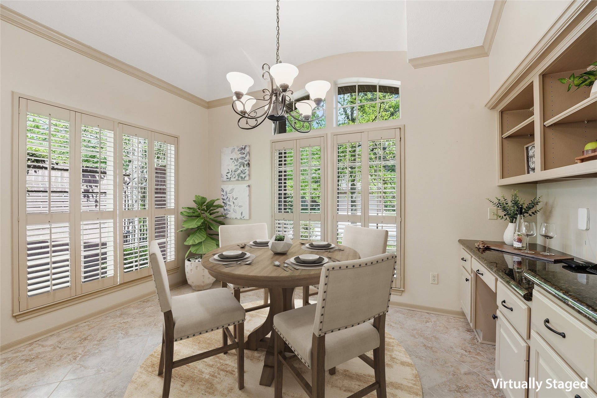 3203 Hickory Brook Lane, Houston, TX 77345 Breakfast nook surrounded by windows, with a built-in desk nearby. Virtually staged.