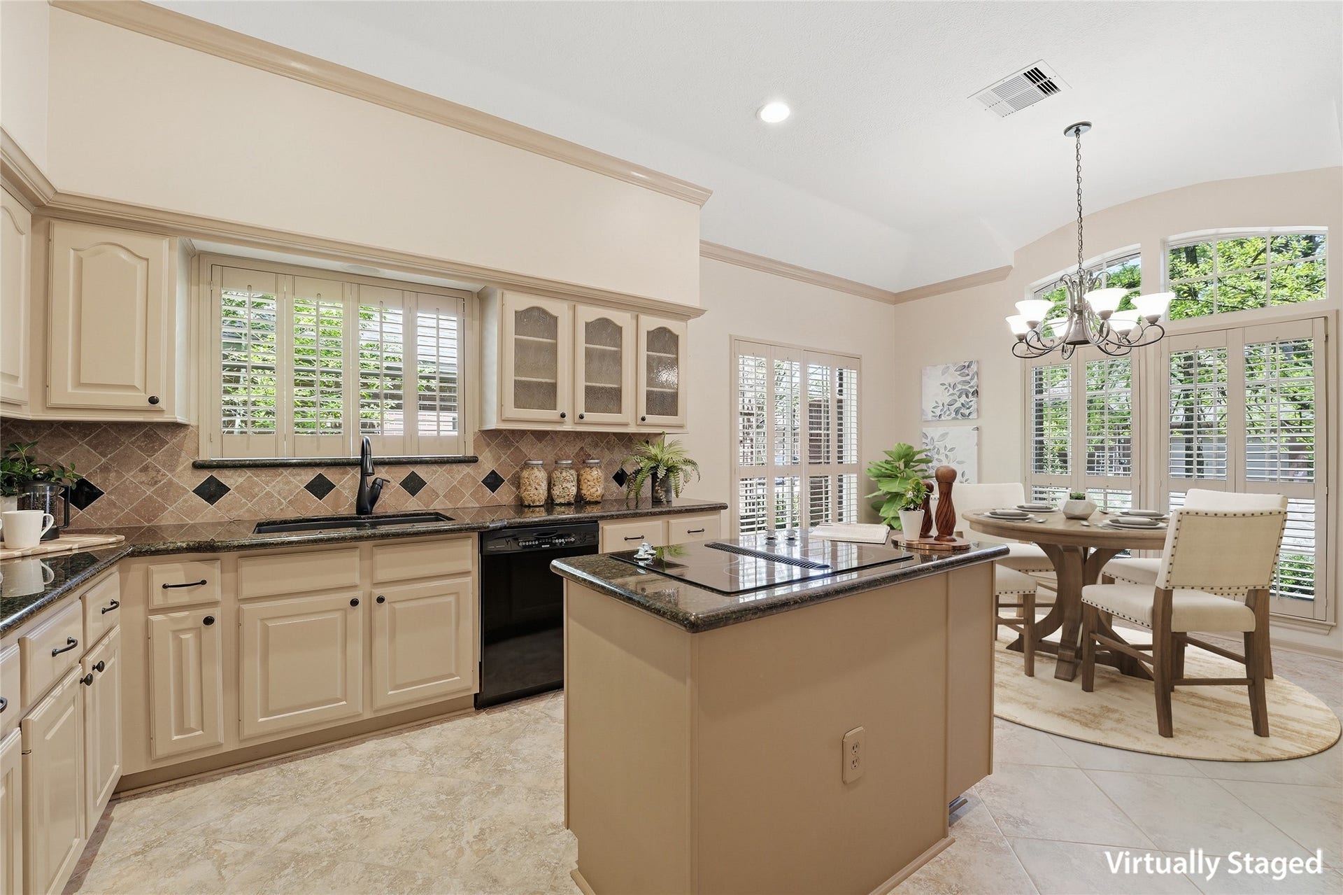 3203 Hickory Brook Lane, Houston, TX 77345 Island kitchen with granite countertops, generous cabinetry and an adjoining breakfast nook. Virtually staged.