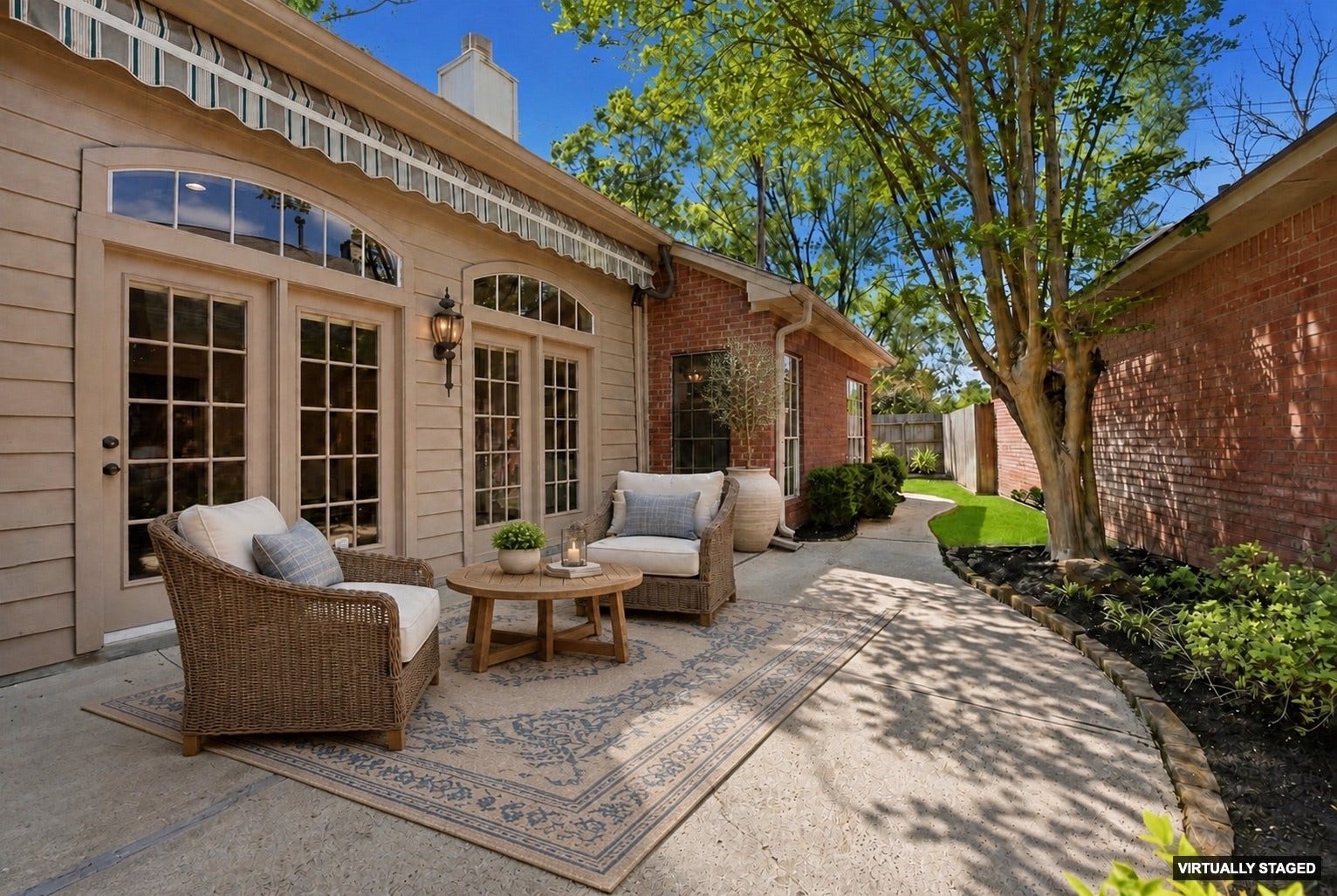 3203 Hickory Brook Lane, Houston, TX 77345 Private patio with a retractable awning and room for outdoor seating. Virtually staged