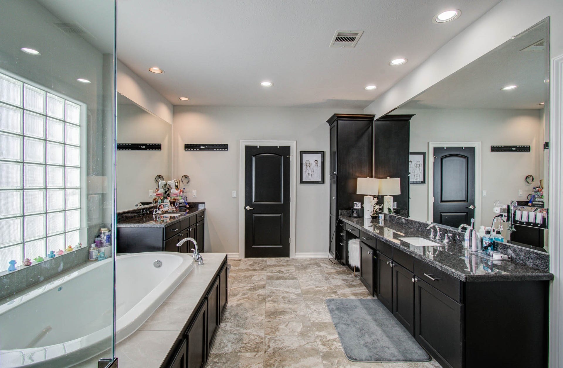 11123 Olympia Drive, Houston, TX 77042 Primary bathroom with 2 walk in closets, separate tub and shower.