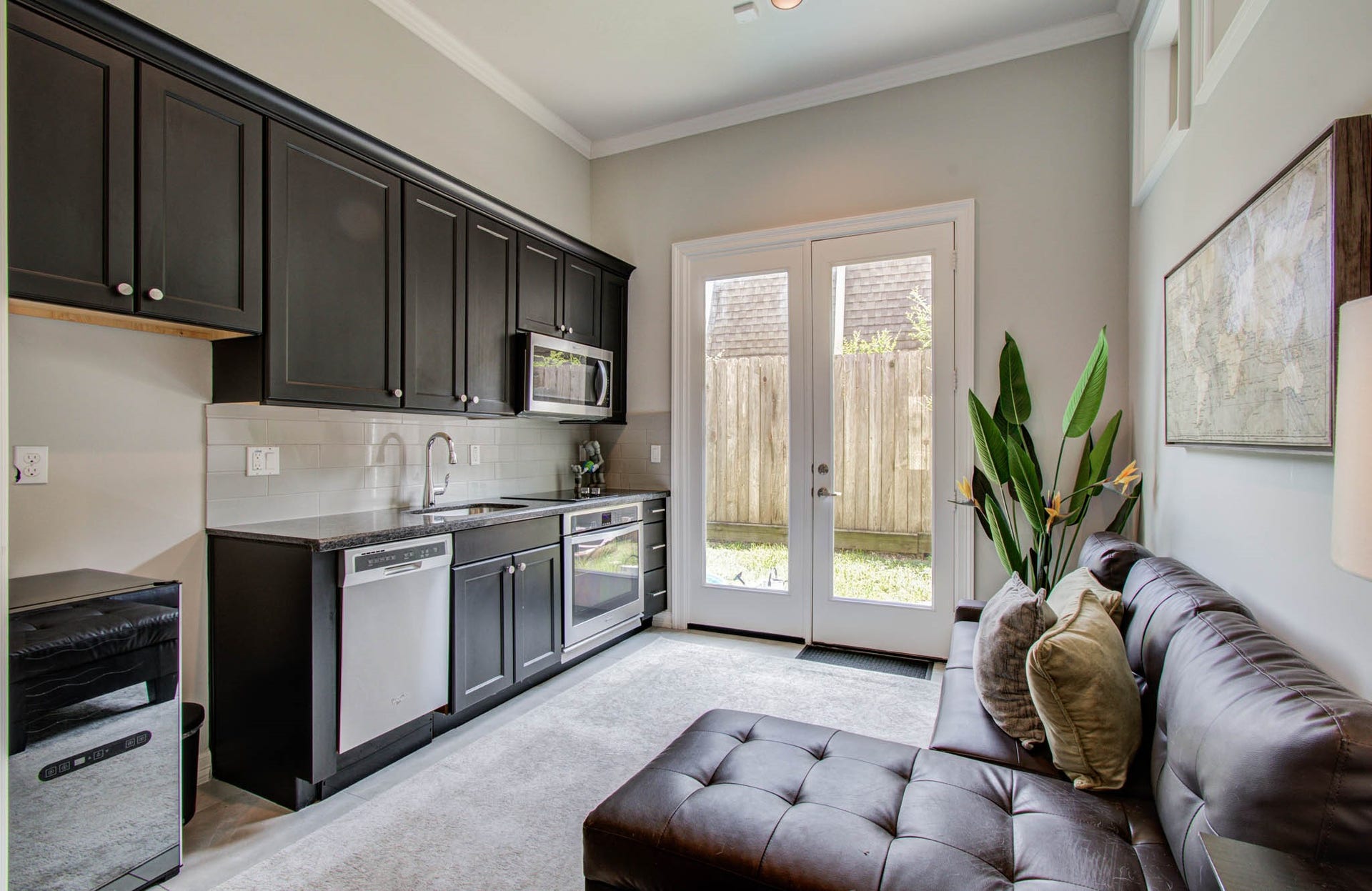 11123 Olympia Drive, Houston, TX 77042 1st floor kitchenette. Includes dishwasher, microwave, oven, and sink.