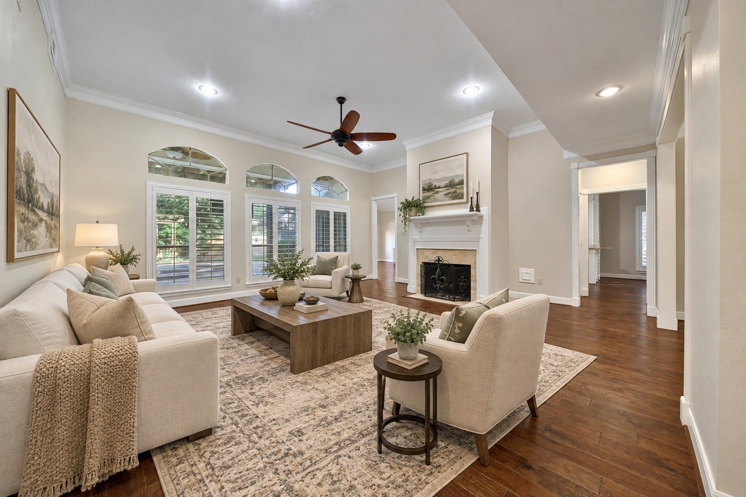 5814 Woodland Creek Drive, Kingwood, TX 77345 This outstanding living room showcases the beautiful hardwood floors. High ceilings, large windows overlooking the patio and pool, plantation shutters, recessed lighting and gaslog fireplace make this a comfortable place to relax or entertain. Photo has been digitally altered using generative ai for virtual staging. Buyer to verify all.