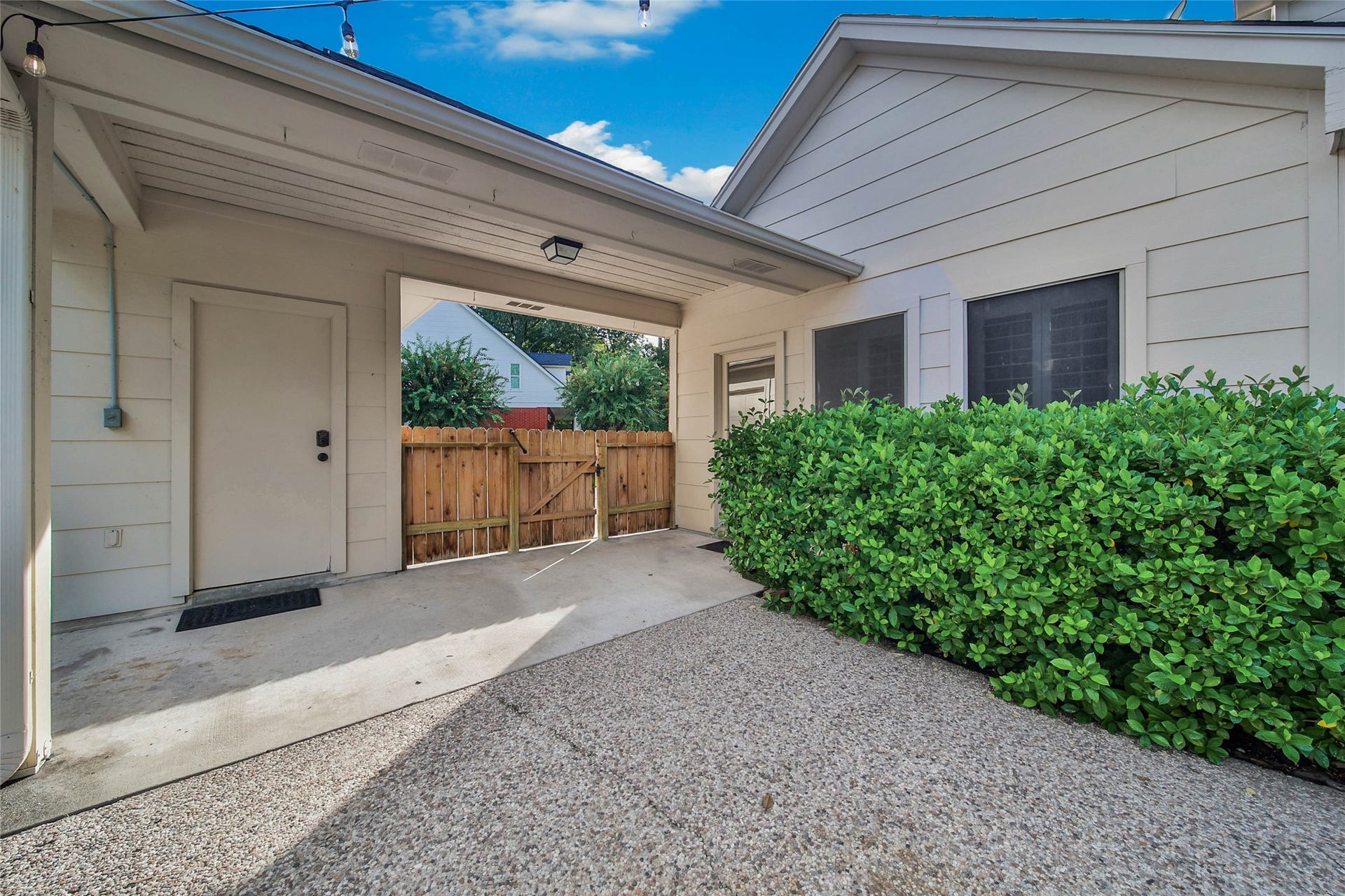 5814 Woodland Creek Drive, Kingwood, TX 77345 Covered breezeway and extended pool decking offer a spacious poolside feel.