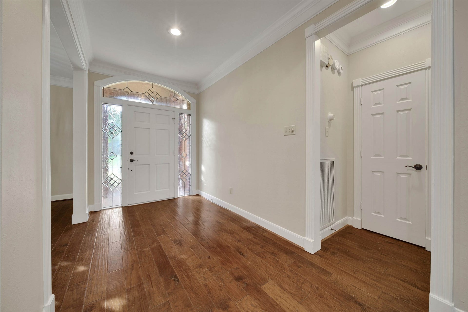 5814 Woodland Creek Drive, Kingwood, TX 77345 Elegant foyer with continuous hardwood floors throughout the main living area.