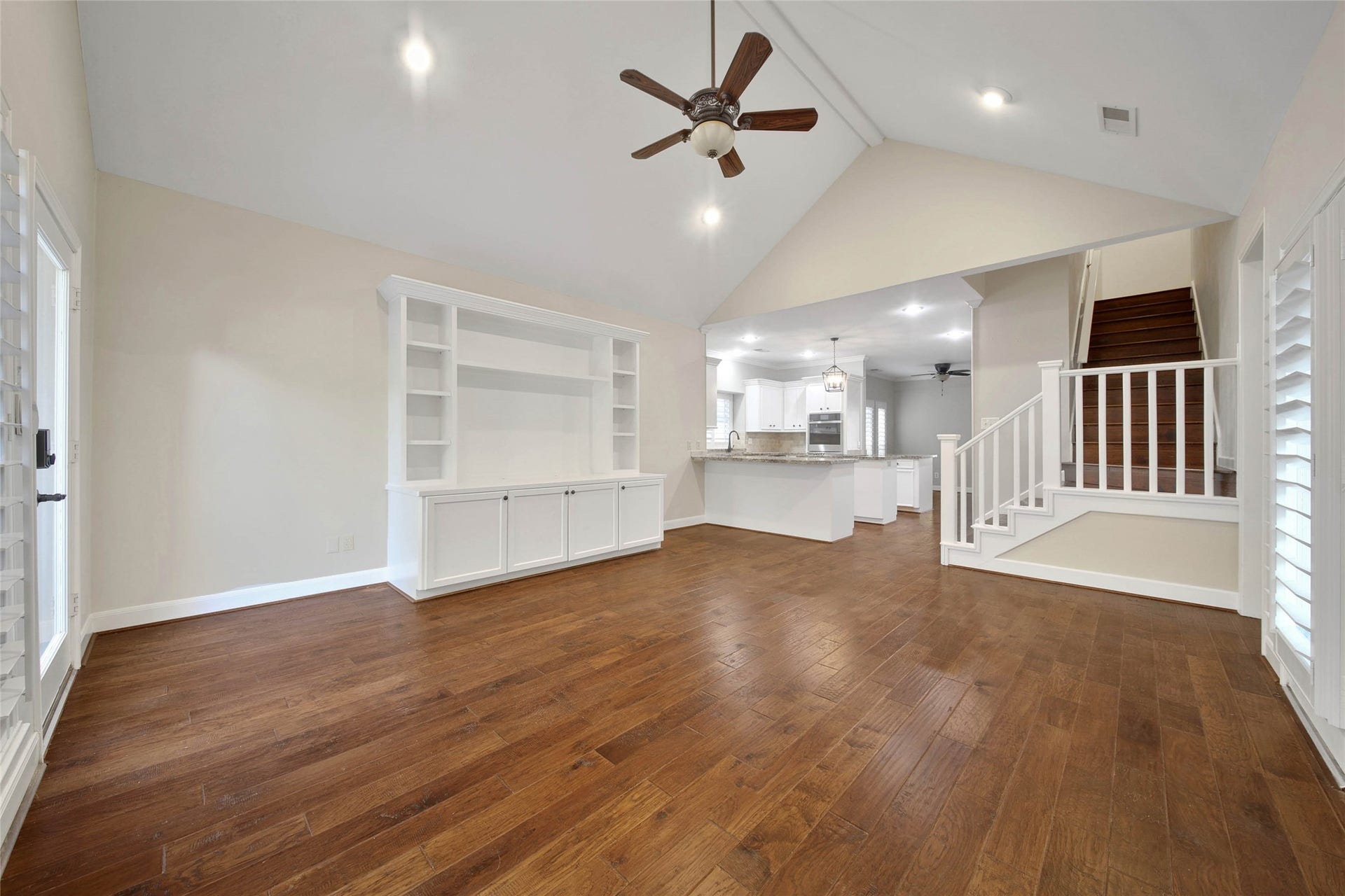 5814 Woodland Creek Drive, Kingwood, TX 77345 The Den is located off the kitchen and has a large built-in for your entertaining needs. Bright windows of the pool, patio and backyard surround this room. Vaulted ceiling adds to the spacious feel.