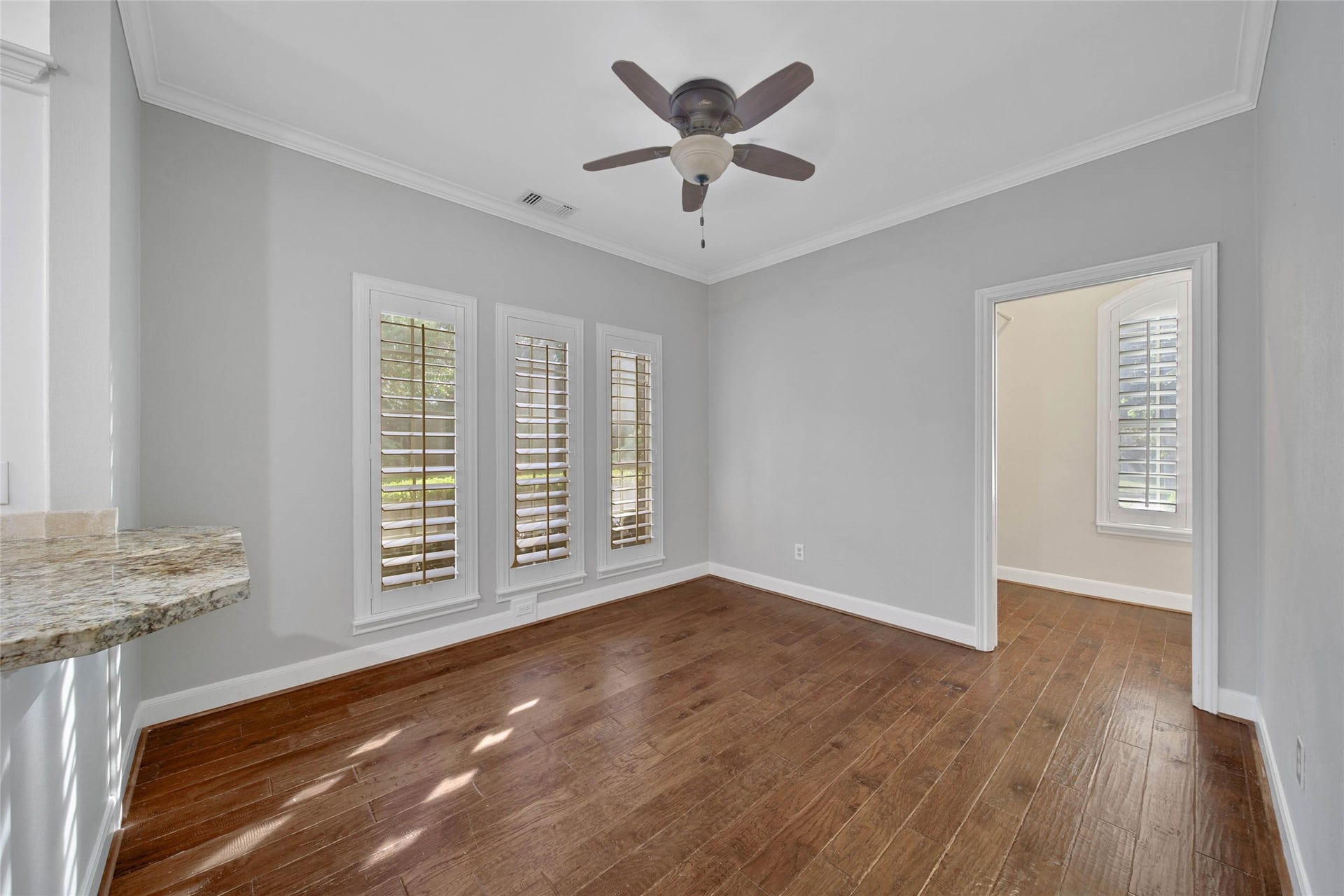 5814 Woodland Creek Drive, Kingwood, TX 77345 Huge breakfast room with adjacent butlers pantry / laundry utility room. Plantation shutters offer an elevated look to this functional space.