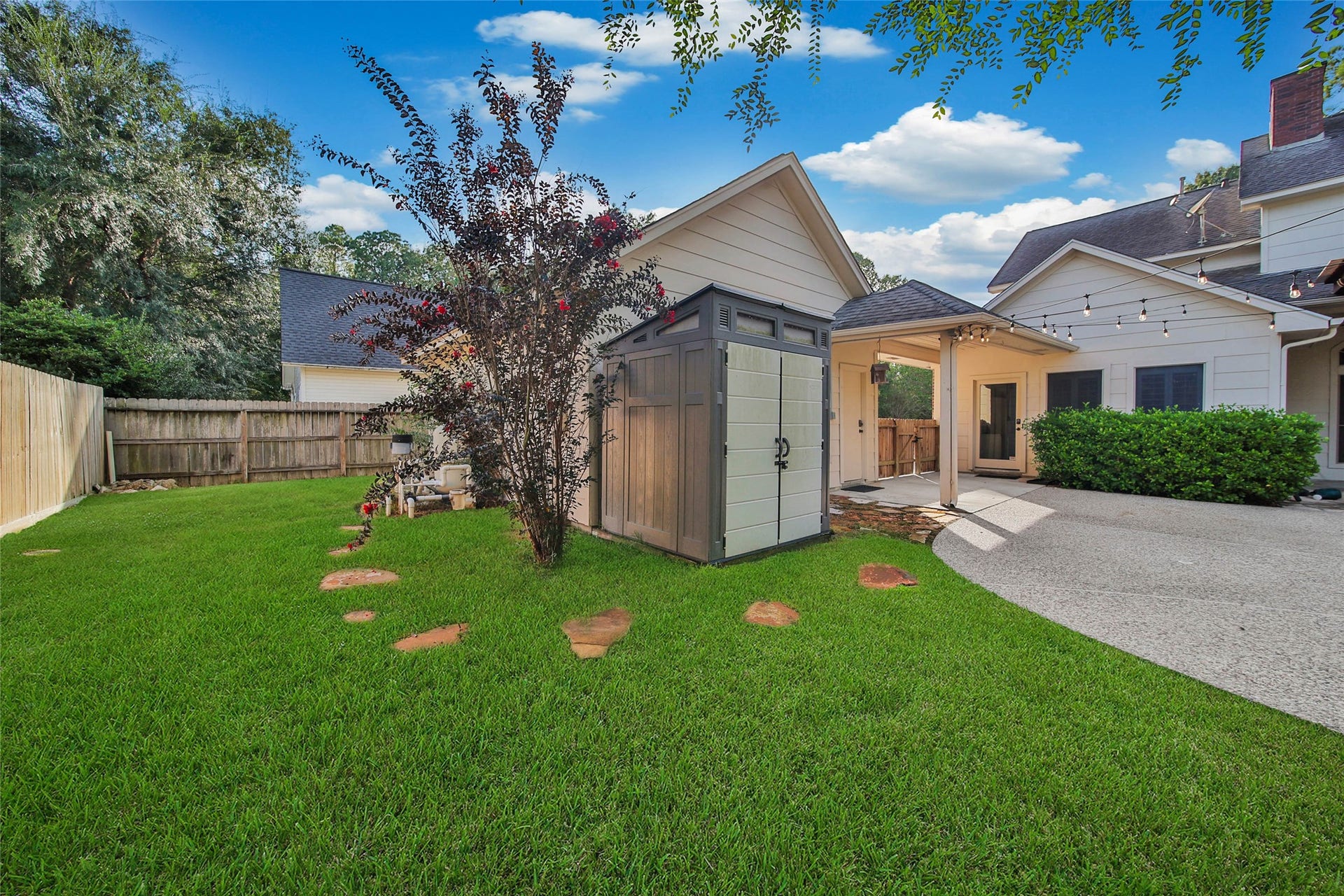 5814 Woodland Creek Drive, Kingwood, TX 77345 Lots of yard space behind the garage. A storage shed is already in place for you!
