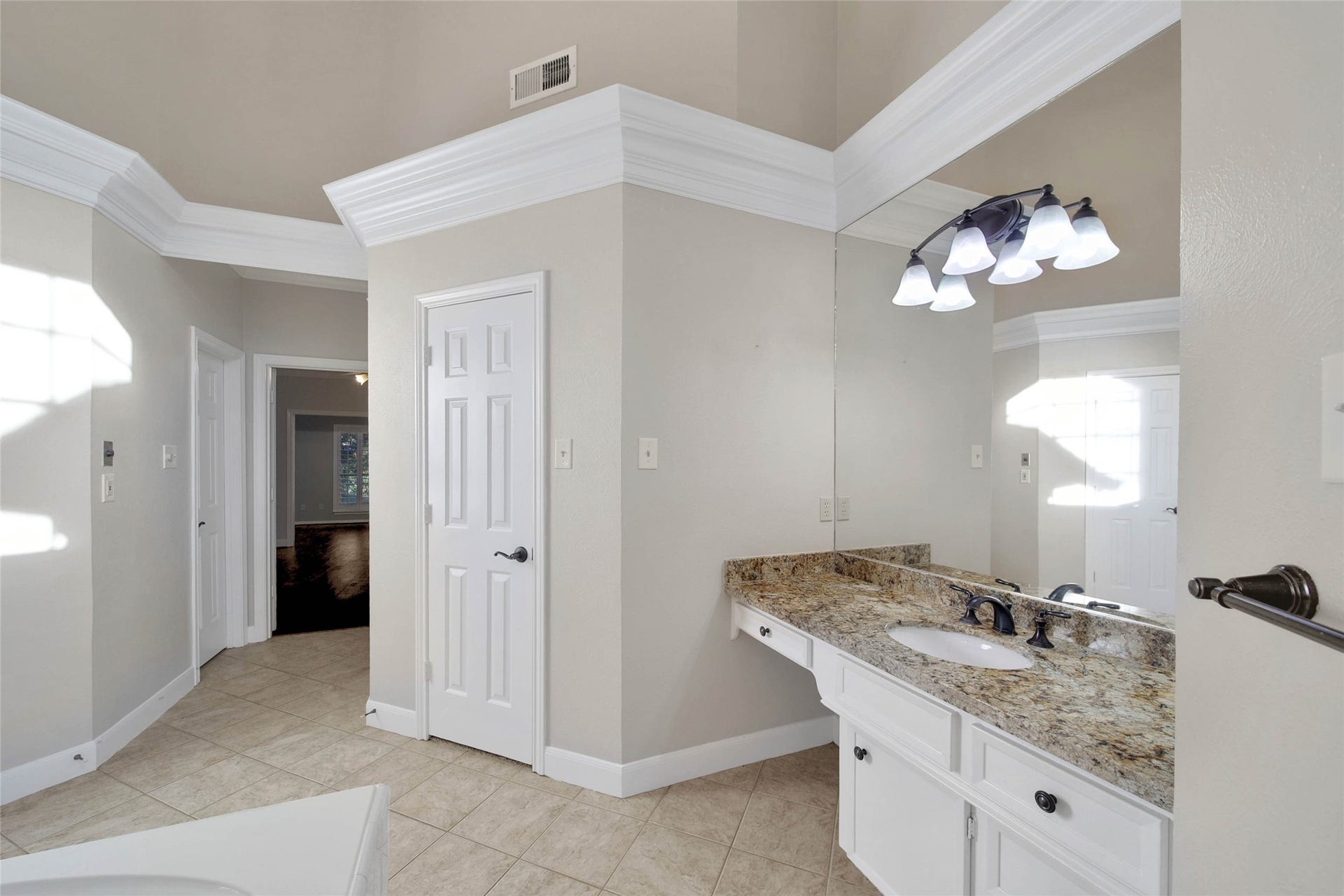 5814 Woodland Creek Drive, Kingwood, TX 77345 Wow the primary bathroom is a suite all by itself! So much to see here! Separate closets, separate vanities, oversize shower, lots of storage, and high ceilings!