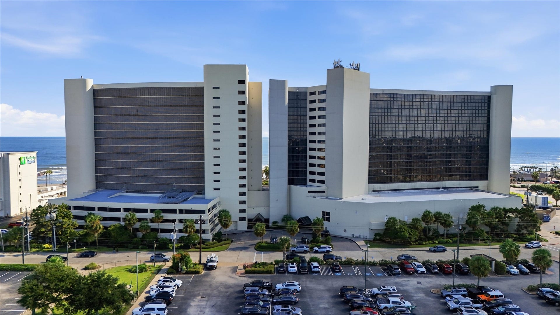 5220 Seawall Boulevard, #1233D, Galveston, TX 77551 The distinctive San Luis towers rise above palm-lined grounds with the Gulf stretching beyond.