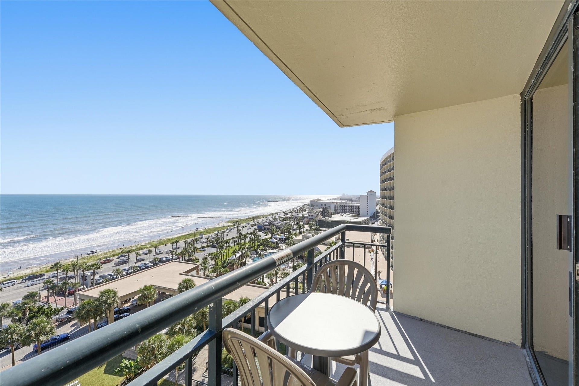 5220 Seawall Boulevard, #1233D, Galveston, TX 77551 Relax on the covered balcony with sweeping coastal views stretching along Seawall Boulevard.