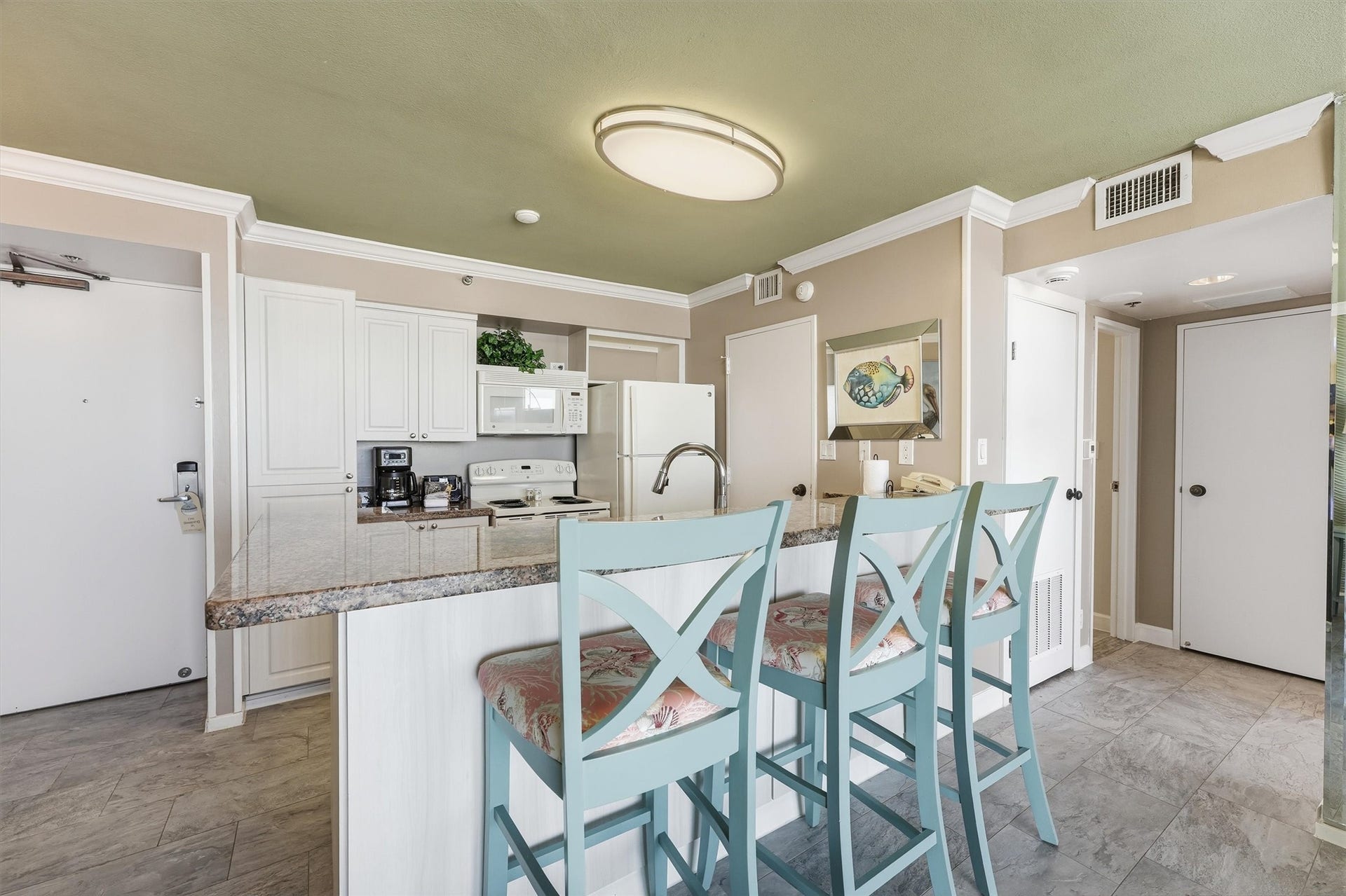 5220 Seawall Boulevard, #1233D, Galveston, TX 77551 Gather at the breakfast bar for casual meals, morning coffee, or conversation while cooking.