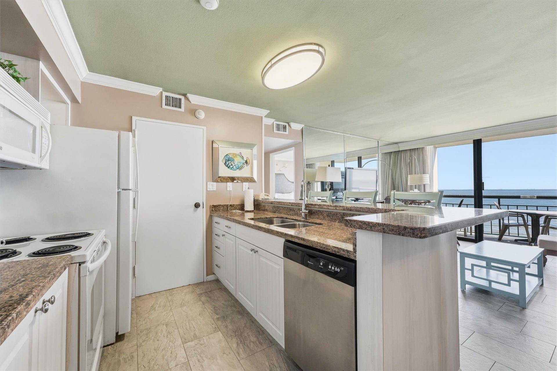 5220 Seawall Boulevard, #1233D, Galveston, TX 77551 Prepare your favorite meals while enjoying an open view into the living area and out toward the Gulf.