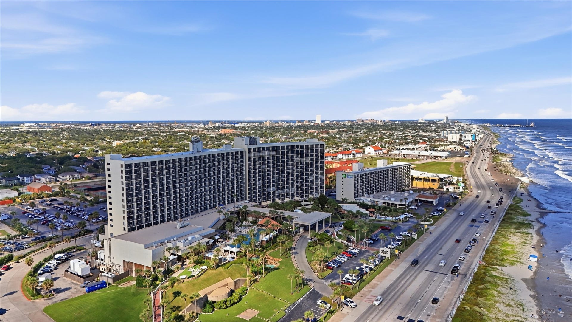 5220 Seawall Boulevard, #1233D, Galveston, TX 77551 This aerial perspective highlights the resort grounds and their beautiful setting along Galvestons coastline.