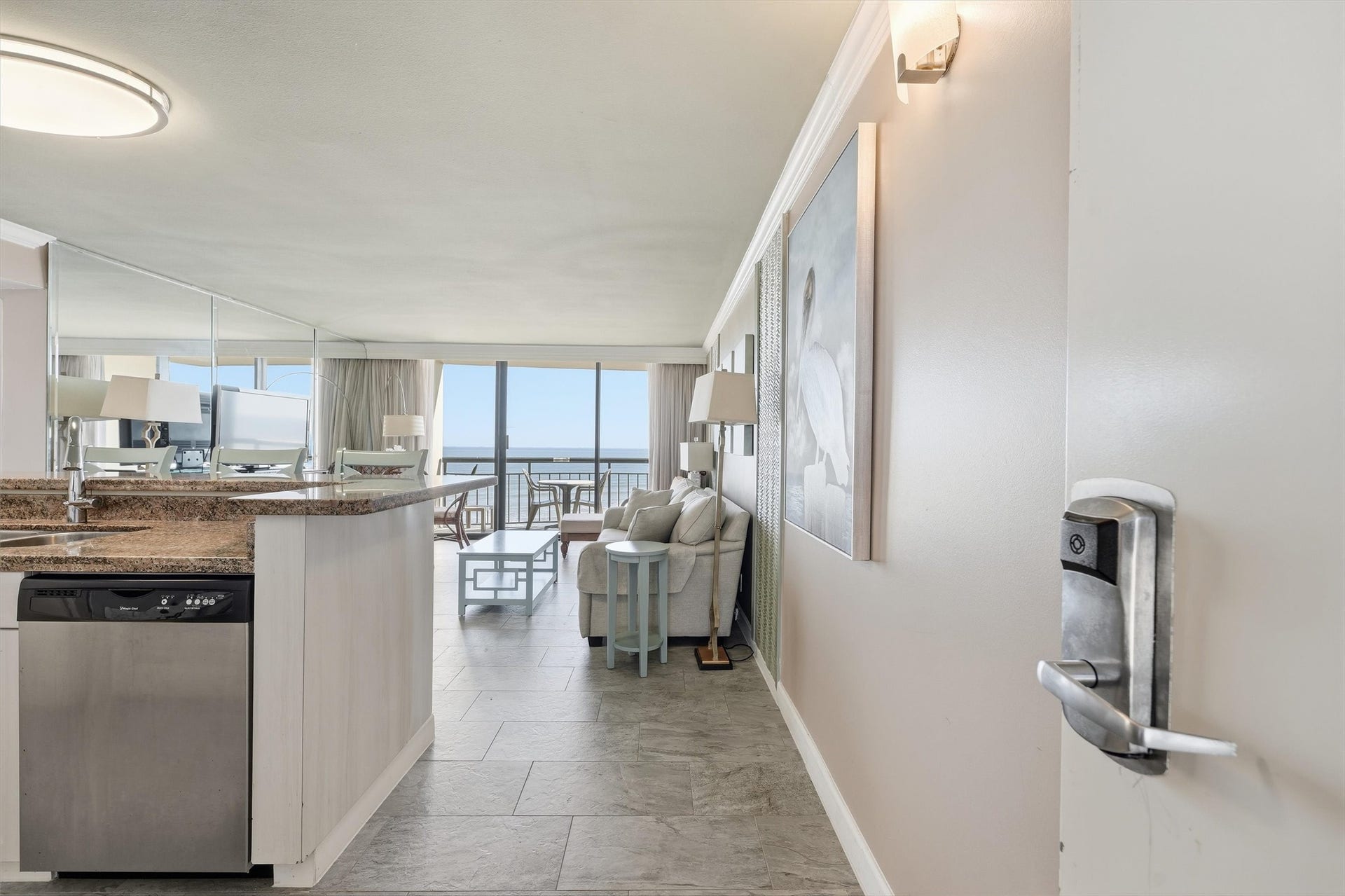 5220 Seawall Boulevard, #1233D, Galveston, TX 77551 A welcoming entry opens to a bright coastal retreat with beautiful Gulf views straight ahead.