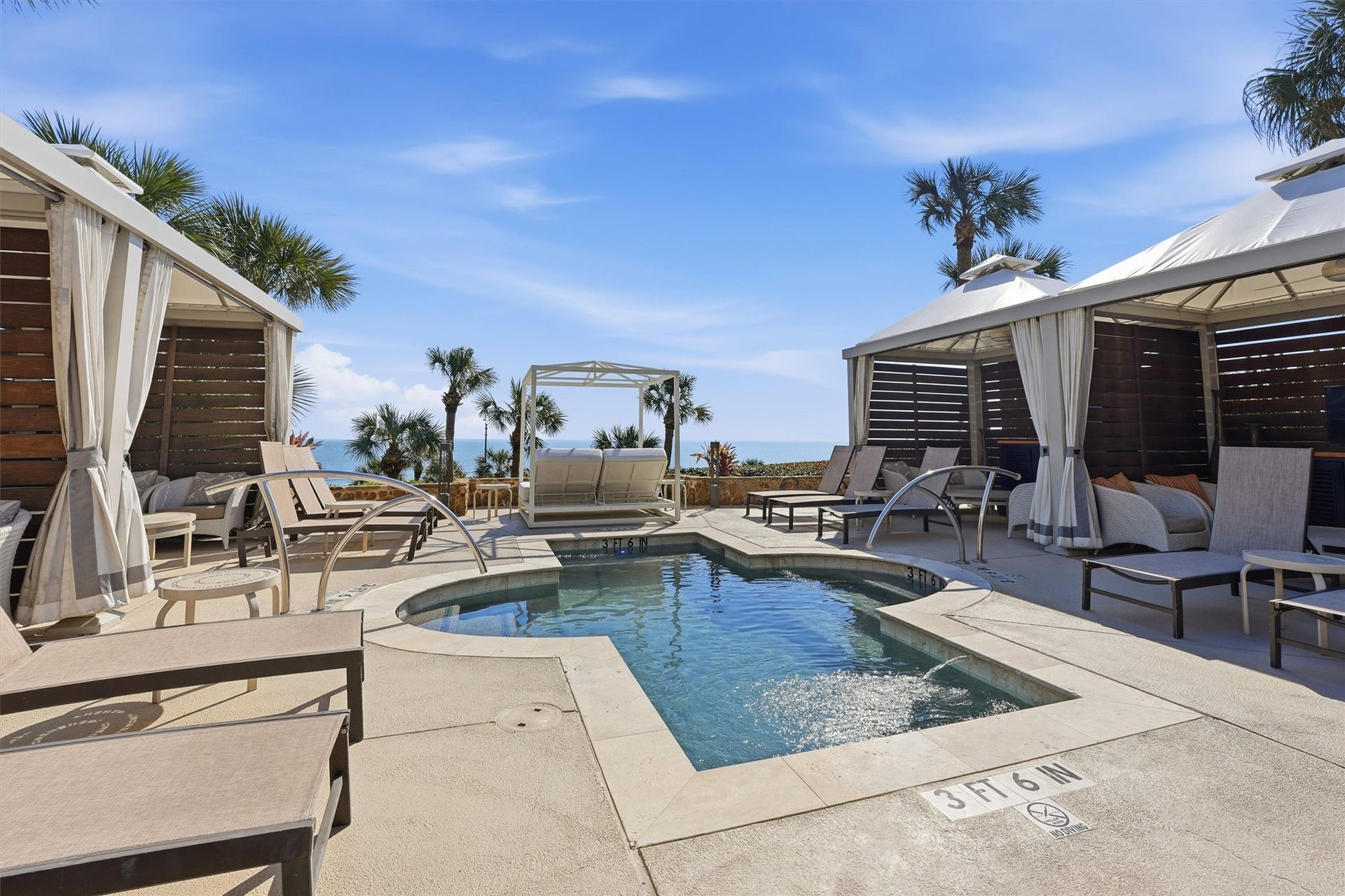 5220 Seawall Boulevard, #1233D, Galveston, TX 77551 The resort pool experience is designed for leisure, featuring ample seating, shaded areas, and a welcoming environment for residents and guests alike.