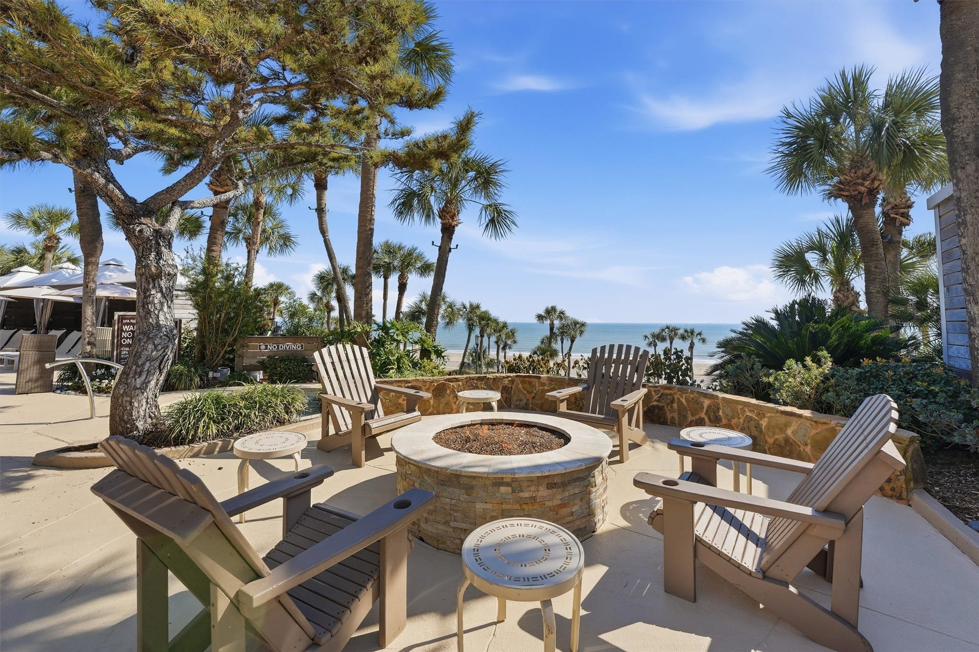 5220 Seawall Boulevard, #1233D, Galveston, TX 77551 Outdoor lounge spaces surround the pool, creating
a relaxed setting for sunbathing, socializing, or
enjoying quiet moments between beach outings