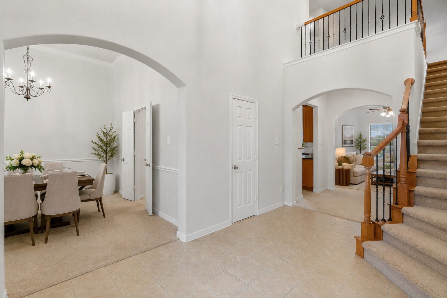 13806 Cove Landing Lane, Rosharon, TX 77583 A bright, open foyer provides seamless access to the formal dining area, staircase, kitchen, and adjoining living spaces.**Virtually staged