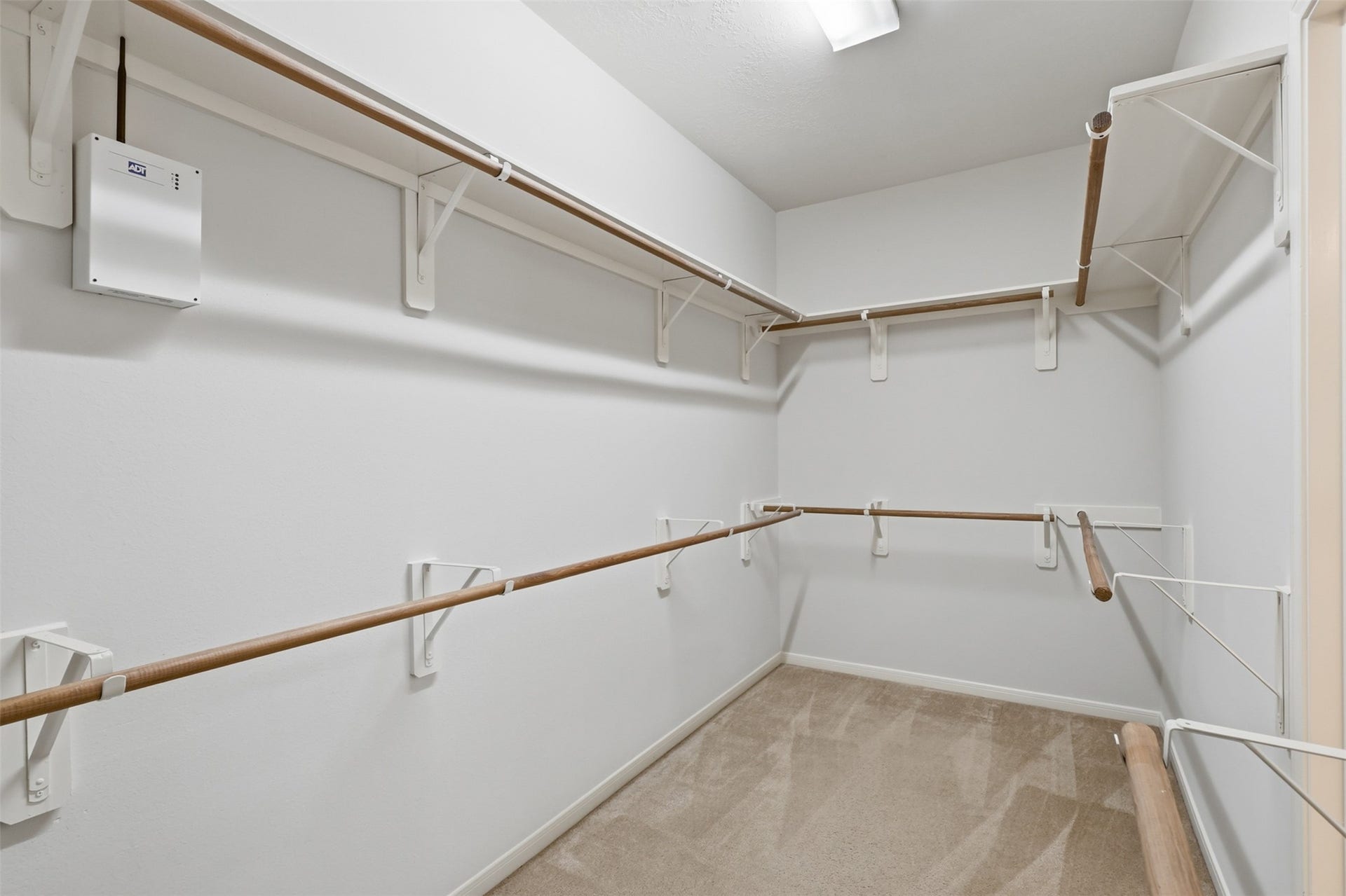 13806 Cove Landing Lane, Rosharon, TX 77583 The large walk-in closet provides extensive hanging and storage space for an organized primary suite.