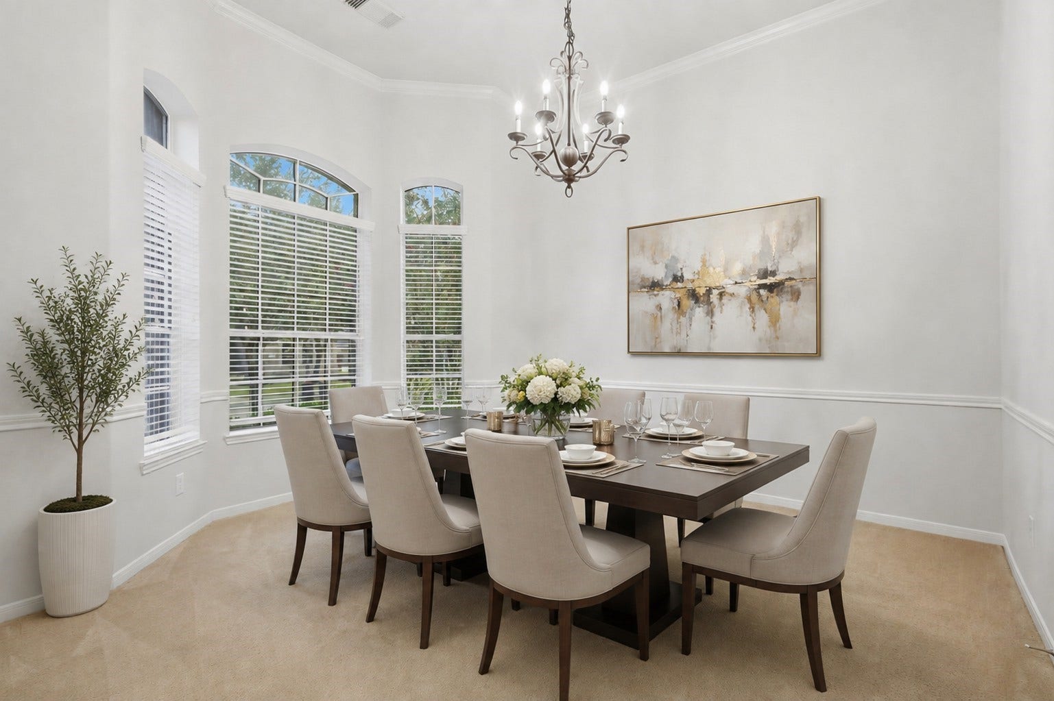 13806 Cove Landing Lane, Rosharon, TX 77583 The formal dining room is enhanced by tall arched windows, abundant natural light, crown molding, and elegant architectural detailing.**Virtually staged