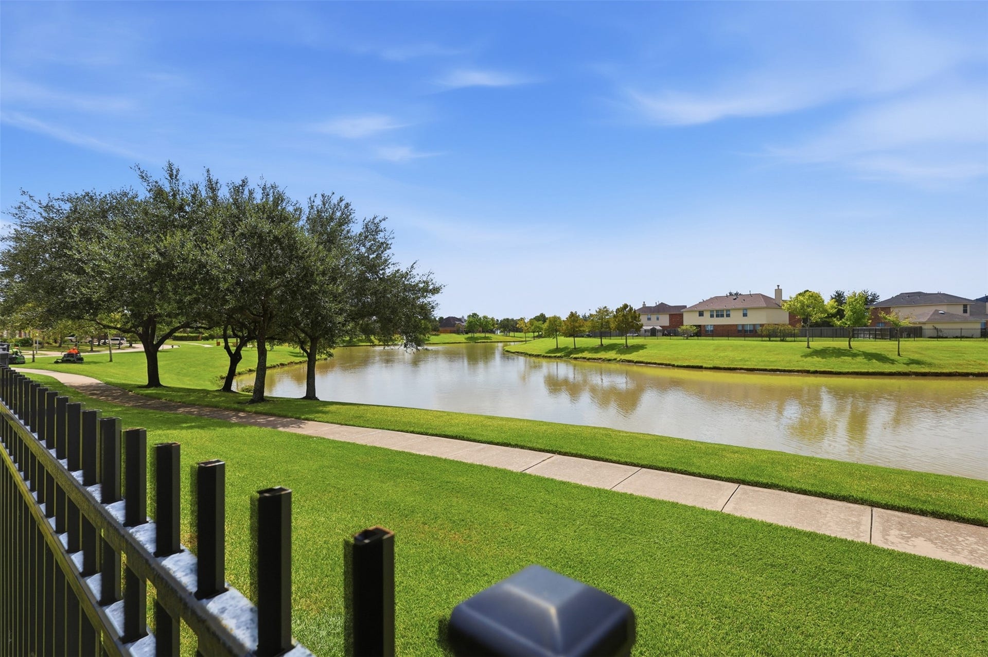 13806 Cove Landing Lane, Rosharon, TX 77583 Residents can enjoy peaceful lake views and a paved walking trail surrounded by maintained community green space.