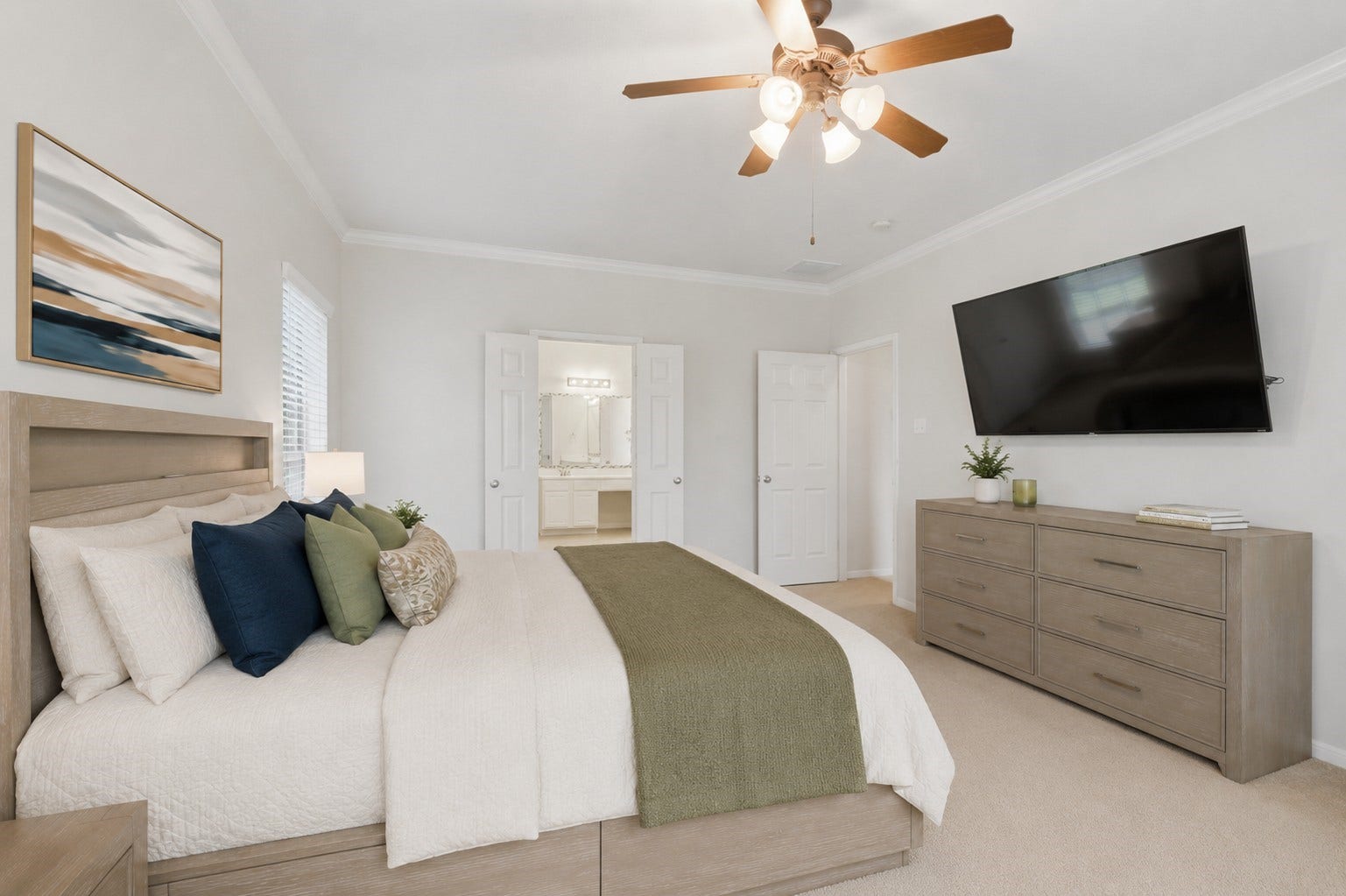 13806 Cove Landing Lane, Rosharon, TX 77583 Another view of the primary suite highlights its generous proportions, crown molding, and convenient access to the en-suite bath.**Virtually staged