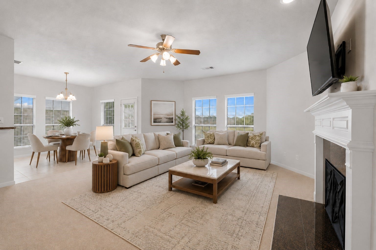 13806 Cove Landing Lane, Rosharon, TX 77583 The spacious family room features abundant natural light, a fireplace with mantel, and an open connection to the breakfast area.**Virtually staged