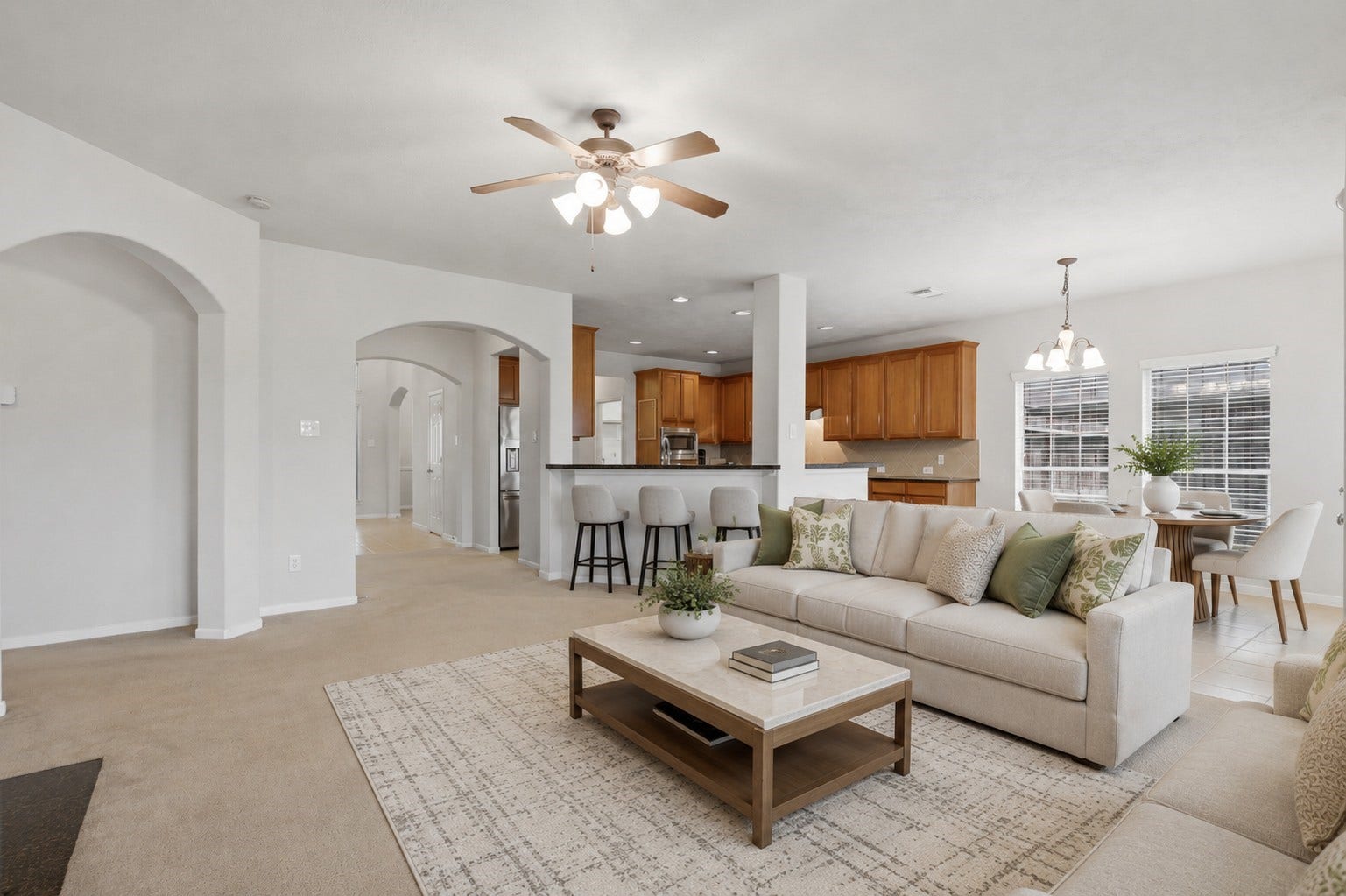 13806 Cove Landing Lane, Rosharon, TX 77583 Another view highlights the expansive family room and its seamless flow into the kitchen and breakfast area.**Virtually staged