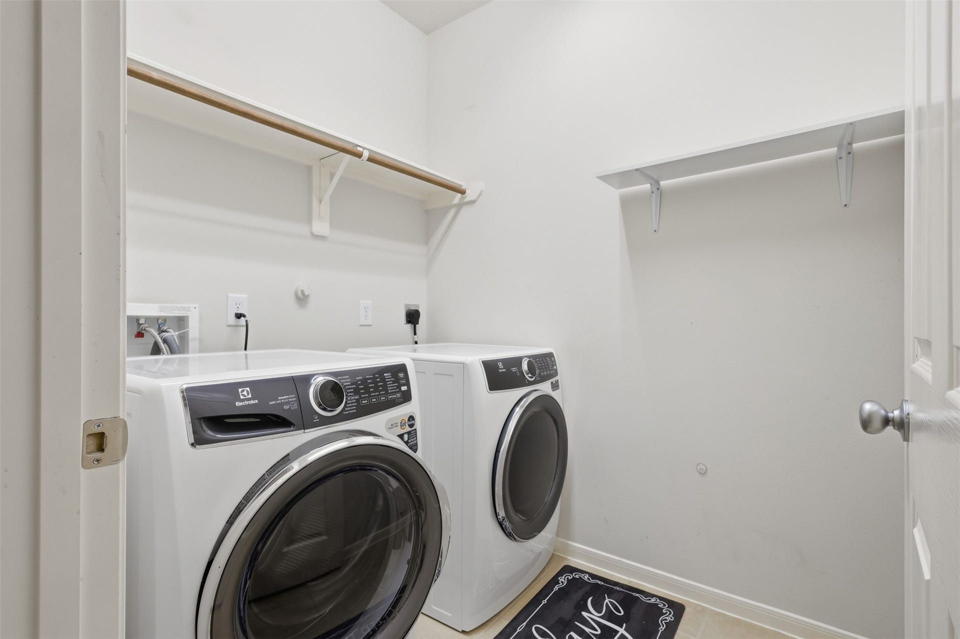 13806 Cove Landing Lane, Rosharon, TX 77583 The dedicated laundry room offers built-in shelving, hanging space, and room for full-size appliances.