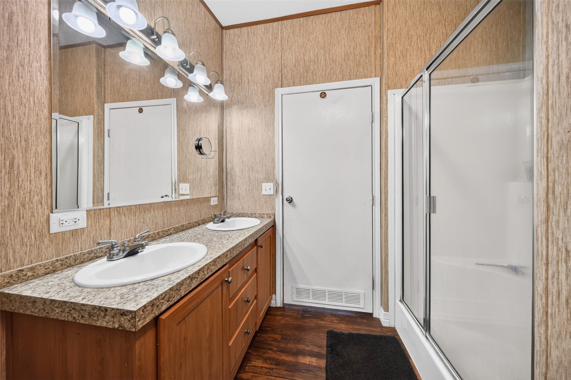 Additional bathroom view highlighting the vanity and storage.