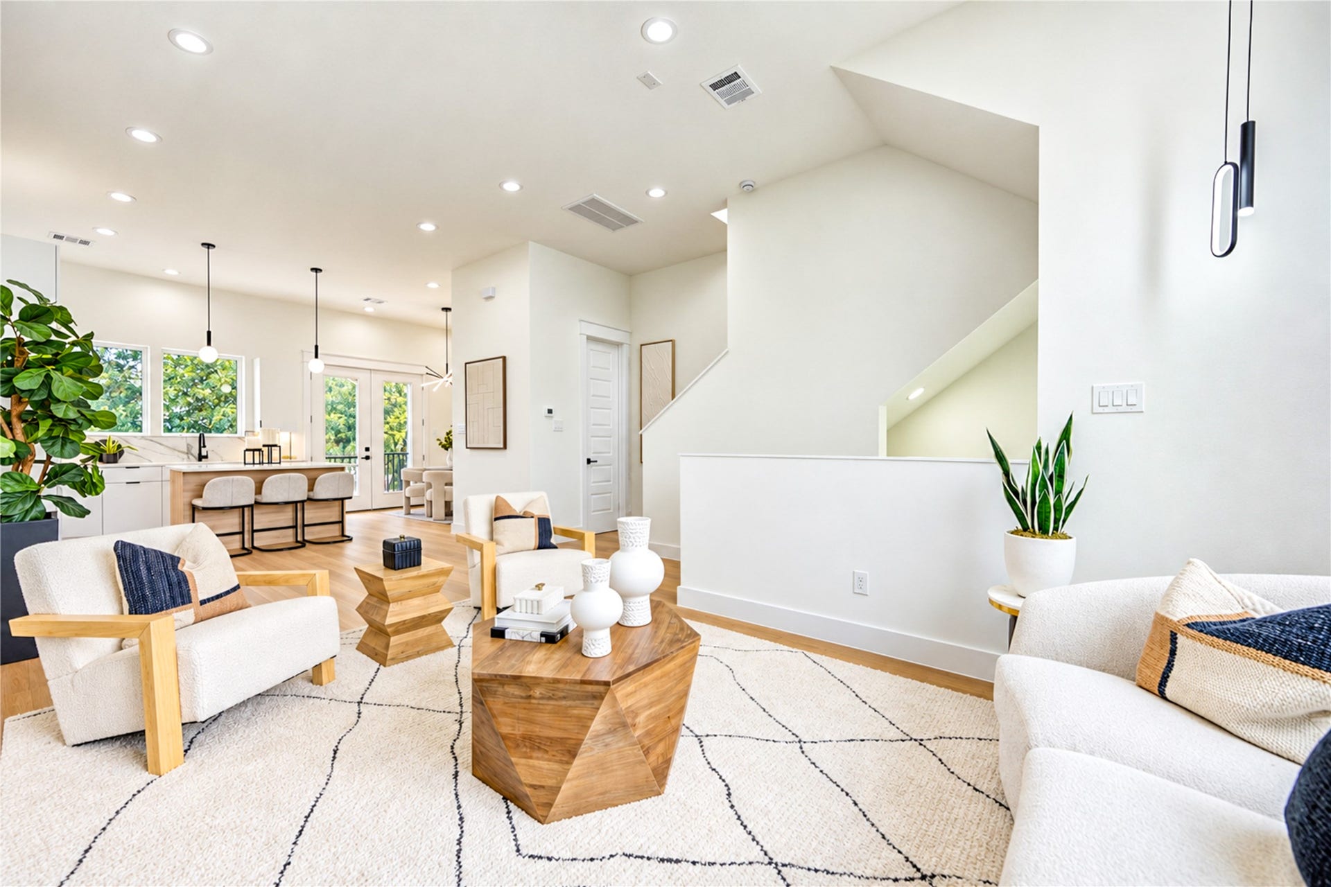 Bright, open living area with 11-foot ceilings and seamless flow to the kitchen and dining space.