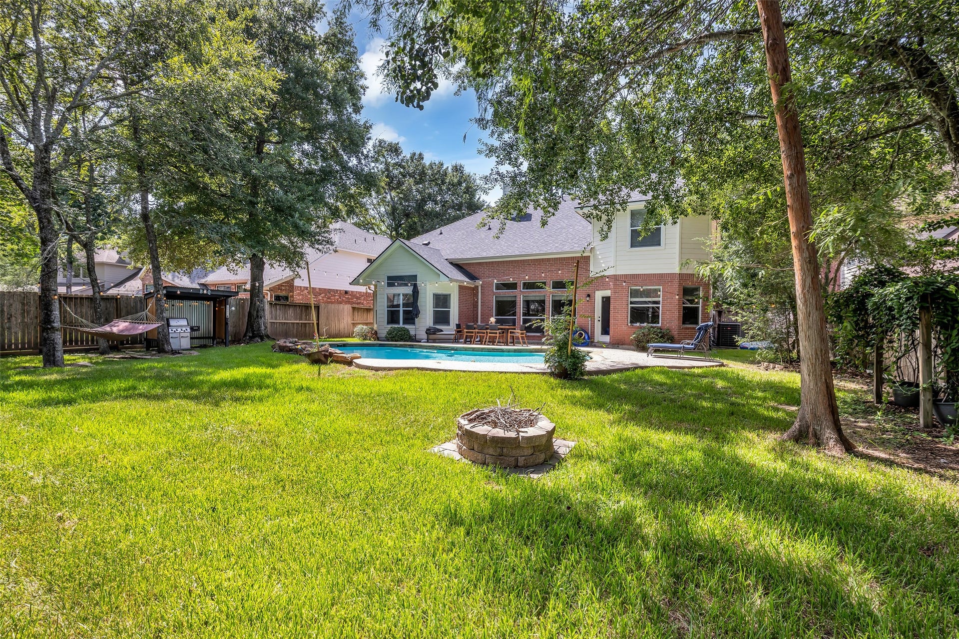 119 N Westwinds Circle, The Woodlands, TX 77382 Large pool is a luxury in the summer! Fire pit for those cool nights!