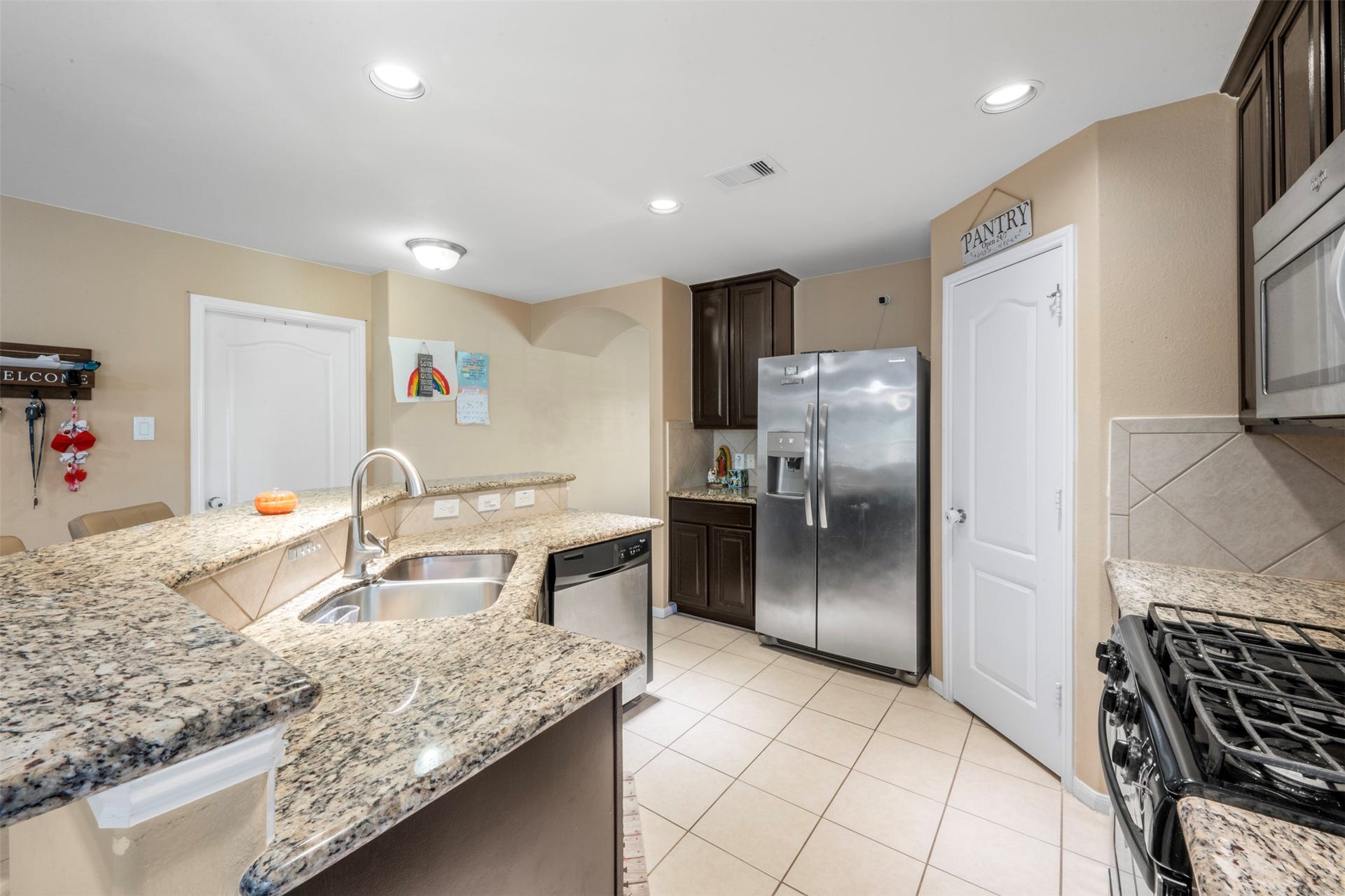 314 Gulf Winds Drive, Bacliff, TX 77518 Enjoy the open kitchen space and bar for a quick casual breakfast.