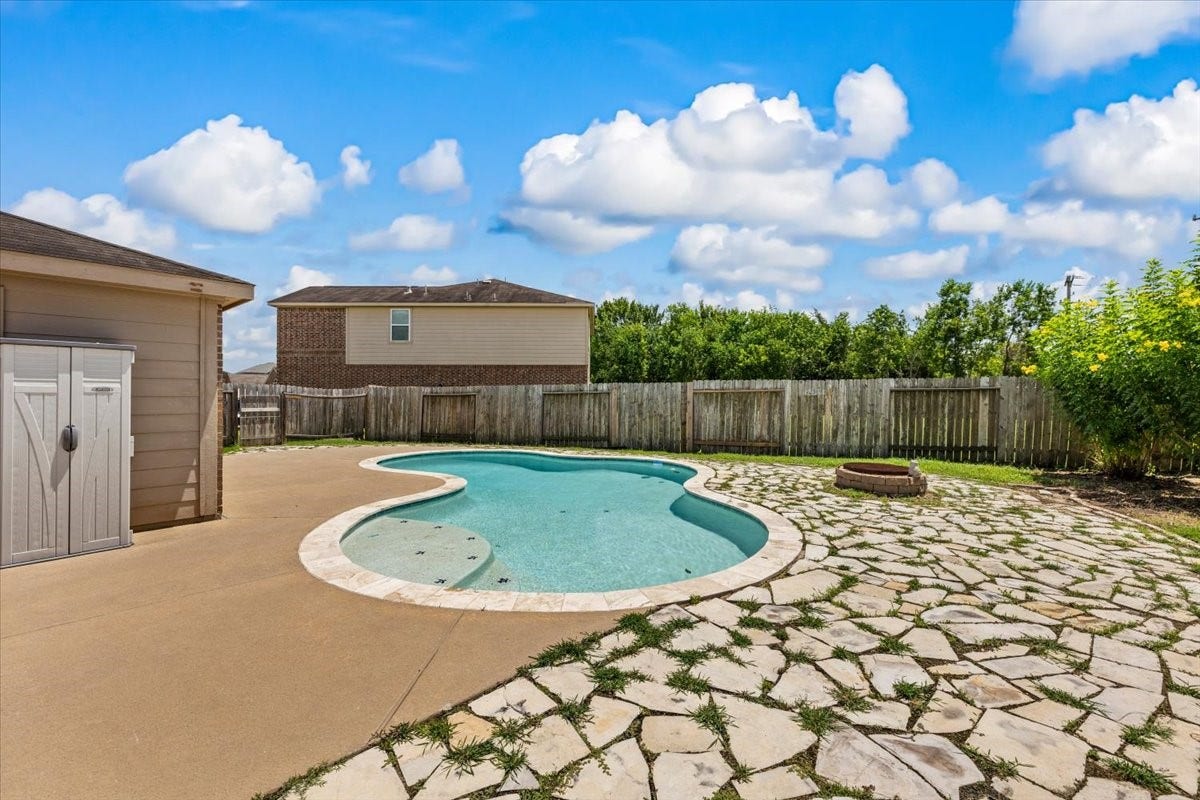 422 Hawks View Drive, La Marque, TX 77568 Private backyard oasis featuring a spacious pool situated on an expansive lot.