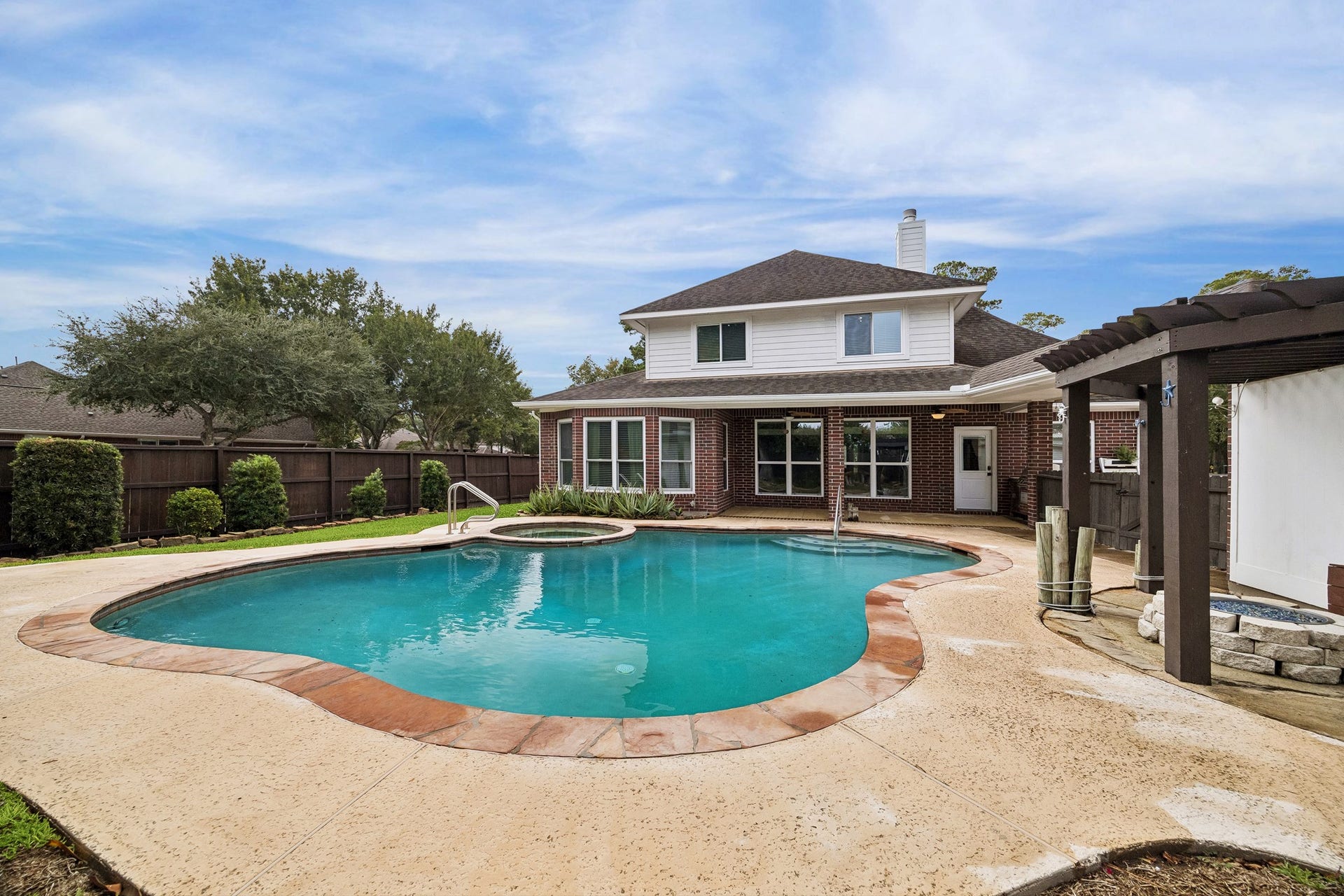 14402 Summerwood Lakes Drive, Houston, TX 77044 Pool and back view of the home