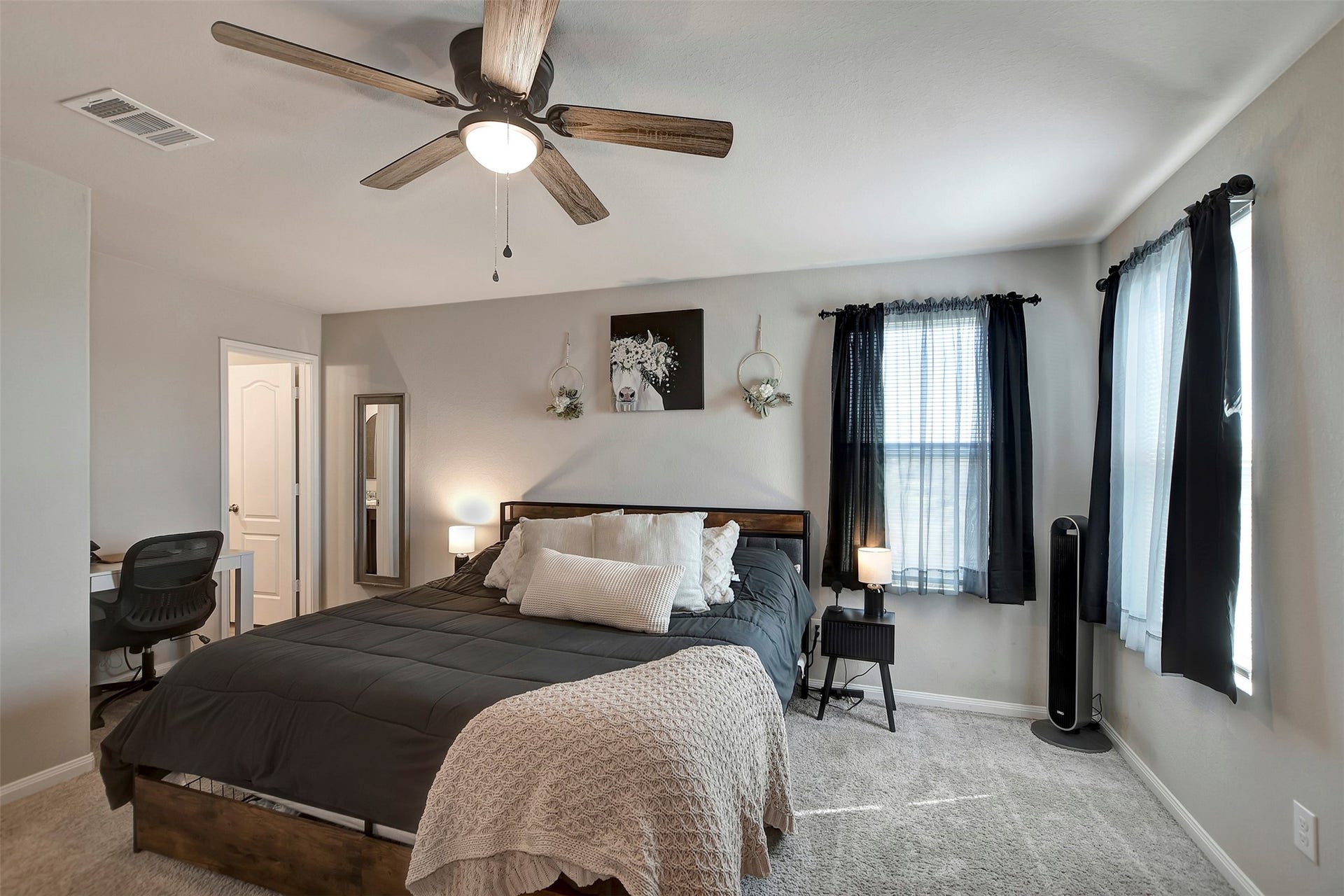 Spacious primary suite located upstairs, offering privacy and comfort.