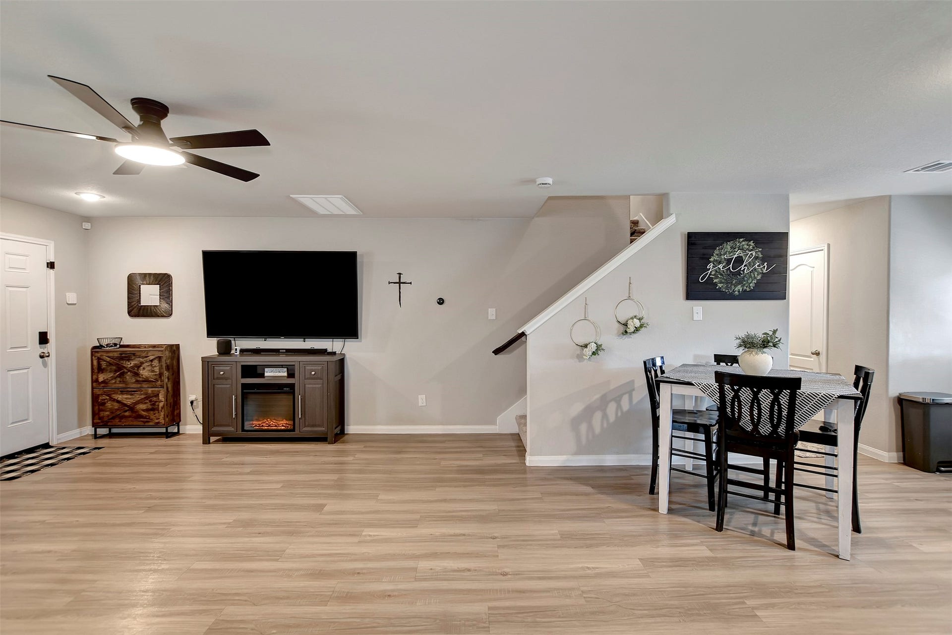 Partial view showcasing the seamless open-concept layout between the living room and kitchen dining area, creating an inviting space ideal for both everyday living and entertaining.