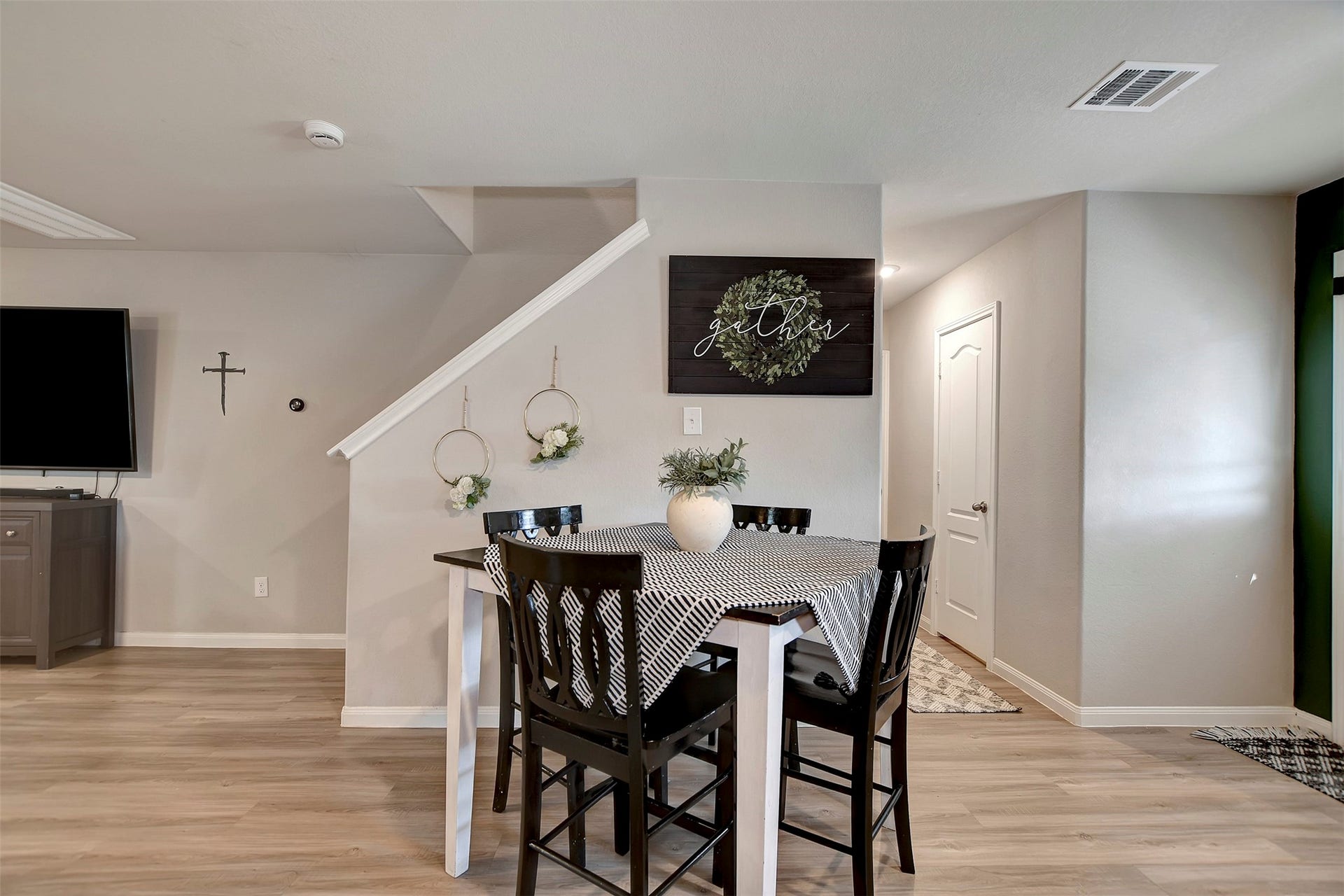Open dining area conveniently located between the kitchen and living room for easy entertaining.